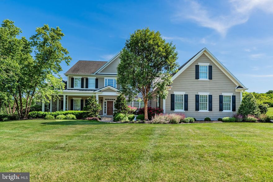 Prestigiously perched on a 3.39 acre lot, this stunning Farinelli custom home showcases breathtaking mountain views and mesmerizing sunsets along with a staycation worthy backyard! Your secluded backyard paradise comes complete with a heated, saltwater, diving depth pool, as well as an outdoor sound system, WiFi and a built-in fire pit. Despite its incredible privacy, this property is located in desirable Hillside Farms - just a short walk from the highly regarded Cumberland Valley Schools. With your well manicured yard offering year round pops of color, an abundance of visiting wildlife and a dedicated gardening space, this property is truly one-of-a-kind. As you drive up, you’ll appreciate the classic elegance, traditional craftsman details and the stunning slate, wraparound front porch. The luxurious appointments don’t stop there. From the grand 2-story foyer with its curved staircase, to the intricate millwork in your elegant dining room, every detail has been carefully considered to impress even the most discerning of homeowners and guests. One of our favorite features is the home's multiple gathering spaces which provide the perfect setting for every occasion. Your impressive 2-story Great Room showcases floor-to-ceiling views of your private backyard as well as access to your impressive party deck. Just imagine entertaining family and friends while taking in the gorgeous sunsets over the mountains. Your expansive, yet inviting Family or Hearth Room is ideal for casual, everyday entertaining. With its rich wooden beams and stately built-ins alongside the natural stone fireplace, this room is ideal for snuggling up with a good book on our cold winter nights. Want a sunnier take on things? Sit and relax in your beautiful Sunroom with walls of windows to enjoy all nature has to offer and heated blue stone floors to keep you comfy year round. No matter your mood, there is a gathering space to suit your needs. Fancy yourself a gourmet chef? Then you are sure to love your cook’s kitchen which boasts 2 Wolf ovens, 2 dishwashers, and other gourmet grade appliances including a paneled refrigerator and additional refrigeration drawers. Rounding out the kitchen are an impressive island with plenty of storage, a convenient wine bar, a breakfast area, ample cabinets and a large walk in pantry. Your main floor owner’s suite is lavish and all inclusive. It features a gas fireplace, an intimate sitting area and a private office. Your expansive owner’s bath boasts a huge soaker tub, a 2-person, multi-head tile shower, separate dual sinks and heated tile floors. Completing the main suite are his/her walk-in closets. Adjacent to the Owner’s Suite is the main floor guest suite with its own dedicated full bath. Upstairs, you’ll find three large bedrooms each with direct bath access. The second-floor primary suite offers a dual sink full bath, a laundry closet, and access to your second-floor deck. Whether you prefer an upstairs or main floor owner’s retreat (or both), this home can accommodate your needs. Your walk-out lower level is perfect for parties, with a full bath convenient for pool guests. The gym could serve as a 6th bedroom if desired. It boasts direct access to the full bath complete with a Jacuzzi steam shower. A finished storage room would make a great future wine cellar, while two additional finished rooms could be used as a theater space and an art/craft room. Your generous 3-car garage boasts an epoxy finish, floor drains for convenient car washing and an 220 EV car charging station. Your lower level garage is ideal for yard equipment or sports cars/toys and includes a workshop. This stunning home is the perfect blend of luxury, privacy, and community, designed for both relaxation and entertaining. Don't miss the opportunity to make this breathtaking property your own.