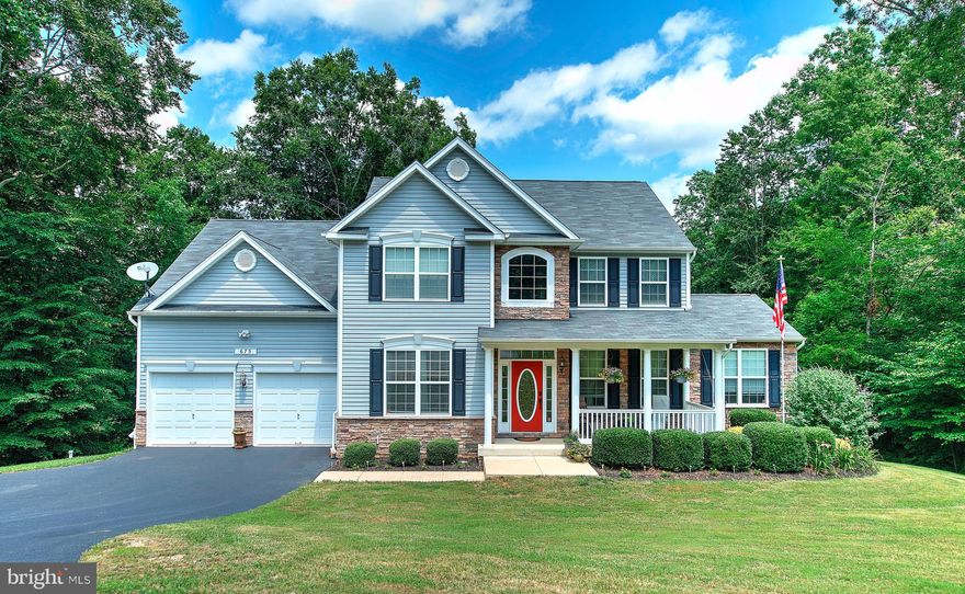 Stunning home, shows like a model, located in desirable College Station! This home sits at the end of the cul-de-sac and backs woods. Enter into a 2 story foyer with Brazilian cherry floors throughout the main level. Separate formal dining room, gourmet eat-in kitchen with granite countertops, island/breakfast bar, opens to spacious living room with fireplace.  Sliders from the kitchen to large deck overlooking the backyard with steps down to the patio and firepit. Upper level boasts 3 bedrooms and full bath plus spacious primary bedroom with walk-in closet and full bath attached. Lower level is fully finished and has 5th bedroom, full bath and family room with access to patio and backyard.  Must see! Don't let this one pass you by!