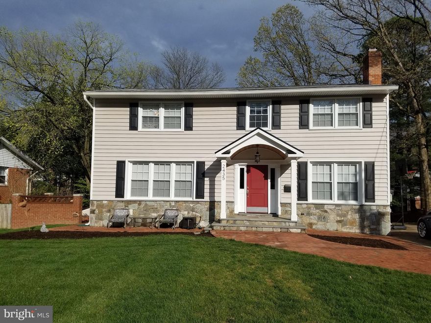 This beautiful, completely updated colonial home is situated on over a quarter acre lot in the sought after Stonewall Manor neighborhood within walking distance to the Dunn Loring Metro Station, Dunn Loring Pool and quick access to the W&OD trail.  The main level has an open concept floor plan with gorgeous built-ins and crown moulding.  The kitchen has stainless steel appliances, granite counter tops and under cabinet lights. Directly off the dining area is a spacious screened in deck complete with heaters and ceiling fan to enjoy the outdoor space throughout the year.  Office has a coffered ceiling and gas fireplace.  A generous sized mudroom is also located on the main level with built-in cubbies and quartz counter tops above front-loading washer/dryer.  Upper level features 4 bedrooms including a spacious master bedroom and exquisite master bathroom with dual vanity, jetted soaking tub, walk-in shower with steam unit and a separate toilet closet.  Walk in closet comes complete with built in drawers and shelving.  The additional 3 bedrooms share a spacious bathroom with dual vanity, walk in shower and jetted soaking tub complete with marble tile throughout.  Basement is full walkout and includes one-bedroom (currently used as a gym), full bathroom and additional bonus room all connected to the main rec room area with built-in bar.  Additional storage can be found in the utility room.  Located directly outside the basement French double doors is a covered under deck area with private hot tub.  Come take a look at all the additional features not mentioned that this home has to offer!