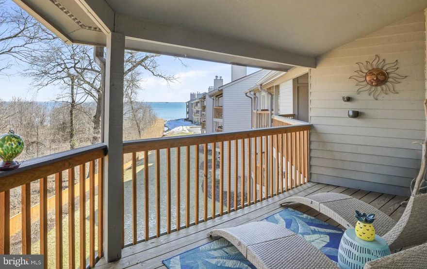 Impressive price reduction makes this unit the best value in Chesapeake Harbour!  Watch sunrises over the Chesapeake Bay from this airy condo in amenity-rich Chesapeake Harbour.  Updated and larger than many other two-bedroom units, this second-floor condo includes a spacious loft - ideal as a family room, home office, or third bedroom. The vaulted living room ceiling, skylights, and sliding doors bring the outdoors in while showcasing bucolic views of the water and nearby woods. The primary suite offers its own sliding doors to the deck, a walk-in closet with extra storage, and an en-suite bath. A second bedroom includes a full wall of closets and west-facing windows that capture the afternoon light.  Additional highlights include a modern kitchen with glass doors opening to a front deck, stainless steel appliances, hardwood floors, and a wood-burning fireplace. Recent seller improvements include a new HVAC system (2025) and a stacked washer and dryer (2023).  

Chesapeake Harbour, a popular gated community just outside historic Annapolis, offers turn-key living and exceptional amenities including outdoor swimming pools, tennis courts, walking trails, and private beaches. The community is also home to the Beacon Waterfront Restaurant and the Chesapeake Harbour Marina, managed by Trident Marine Group. The marina offers wet slips, transient slips, lifts, and concierge services.

Come enjoy the Annapolis waterfront lifestyle, peaceful Chesapeake Bay views, and turn-key living in this resort-like setting.