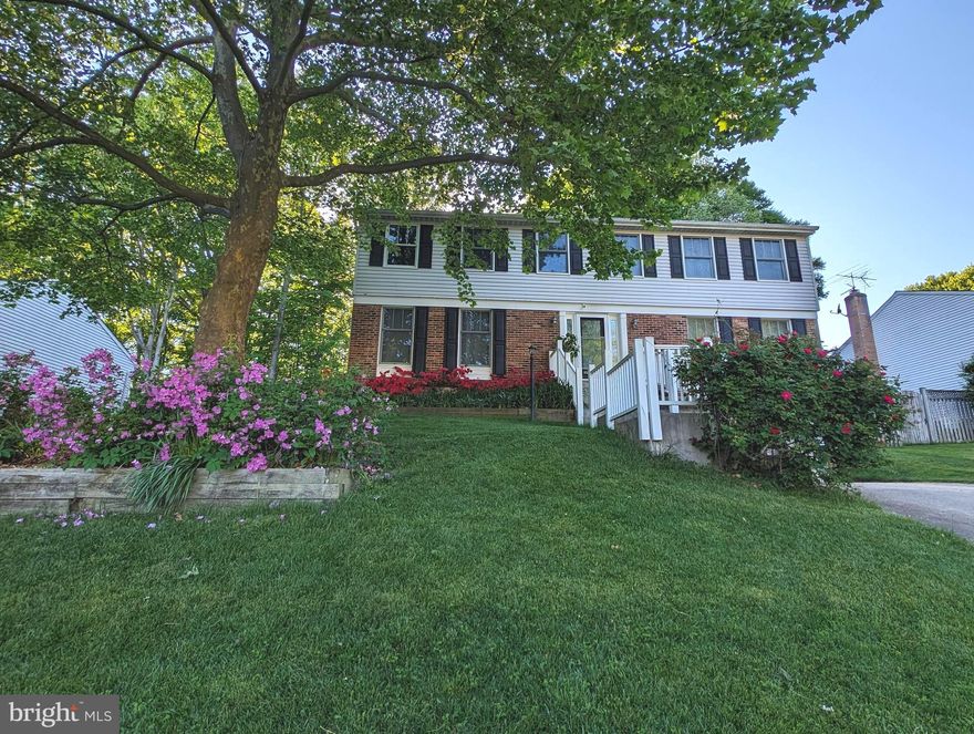 Welcome to this beautifully updated 3-level Colonial, tucked away on a quiet street and offering over 3,000 sq ft of finished living space. With 5 bedrooms, 3.5 bathrooms, a 2-car garage, and a fantastic screened-in deck overlooking serene woods—this home truly has it all! Freshly painted throughout & featuring brand-new flooring on every level, it’s completely move-in ready. All 3 full bathrooms include heated tile floors & heated towel racks for a luxurious touch. No HOA! The main level showcases gleaming hardwood floors & sun-filled living spaces that create an inviting, open feel. A separate living room w/built-in surround sound and a formal dining room w/updated lighting add charm and function right off the entry. The spacious family room features a charming brick-style fireplace with an energy efficient wood stove insert and seamlessly connects to the kitchen—perfect for everyday living and entertaining. A sliding glass door leads to the stunning screened-in deck, complete with a vaulted, beamed ceiling, lighted ceiling fan, and dual skylights, creating a relaxing outdoor retreat. Step beyond to an additional open-air deck and a flat, grassy backyard—ideal for play, gatherings, or simply enjoying nature. This home truly checks all the boxes! The kitchen is both stylish and functional, showcasing wood cabinetry, sleek granite countertops, and stainless-steel appliances including a new Frigidaire electric range (2024). You'll love the large pantry, recessed lighting, and oversized windows offering peaceful wooded views. There's also a cozy breakfast nook and space for a casual dining table. A main-level powder room adds extra convenience for guests. Upstairs, you'll find five spacious bedrooms, all newly carpeted for a fresh, cozy feel. Each room is thoughtfully designed with a lighted ceiling fan and ample closet space. The primary suite offers a peaceful retreat, featuring a large walk-in closet and a beautifully updated en suite bathroom with dual sinks, a tiled shower with sliding glass doors, and built-in bench seating for added comfort. The hall bathroom is equally well-appointed, offering a dual-sink vanity and a convenient tub-shower combination—perfect for busy mornings or evening wind-downs. The fully finished lower level offers a spacious and versatile area, complete with an entire wall of extended closet space, recessed lighting, a wet bar, and a full bathroom featuring a walk-in shower. This flexible space can serve as a 6th bedroom, home office, kids’ playroom, guest suite, or anything you need. Walk-out access to the backyard adds extra convenience. Additional lower-level highlights include a bonus/storage room with a second refrigerator, a separate utility room, & direct access to the 2-car garage. Feeds to highly ranked Hunt Valley Elementary, Irving Middle, and West Springfield High School. Updates in 2024 include new roof w/architectural shingles & warranty, and a new HVAC (Carrier Performance 17 heat pump & variable speed blower coil.) House also features an underground sprinkler system w/Rachio smart controller, an EV charging plug in garage, 2 solar panels (paid off), & solar water heater. Hook up for washer/dryer in the primary bedroom. Excellent location just outside the beltway! Convenient access to Fairfax Cp Pkwy, 395/495/95. Close to Metro bus, Franconia-Springfield Metro, Commuter lots & Springfield/Burke VRE locations. Close proximity to George Mason University, Ft Belvoir, Lake Accotink Park, Burke Lake Park, Huntsman Lake, S Run Rec Centre, Springfield Golf/Country Club, Springfield Town Center, Springfield Plaza & a plethora of restaurants.  Just minutes to DC, The Pentagon, Reagan National Airport, Alexandria, Arlington, Tyson's Corner and more. Very walkable community with nearby bike trails & walking paths. 2 miles to local shopping including Huntsman Sq/Rolling Valley/Burke Town Plaza. Nearby swim & racquet clubs. Make your appointment today! (Pics are virtually staged. )