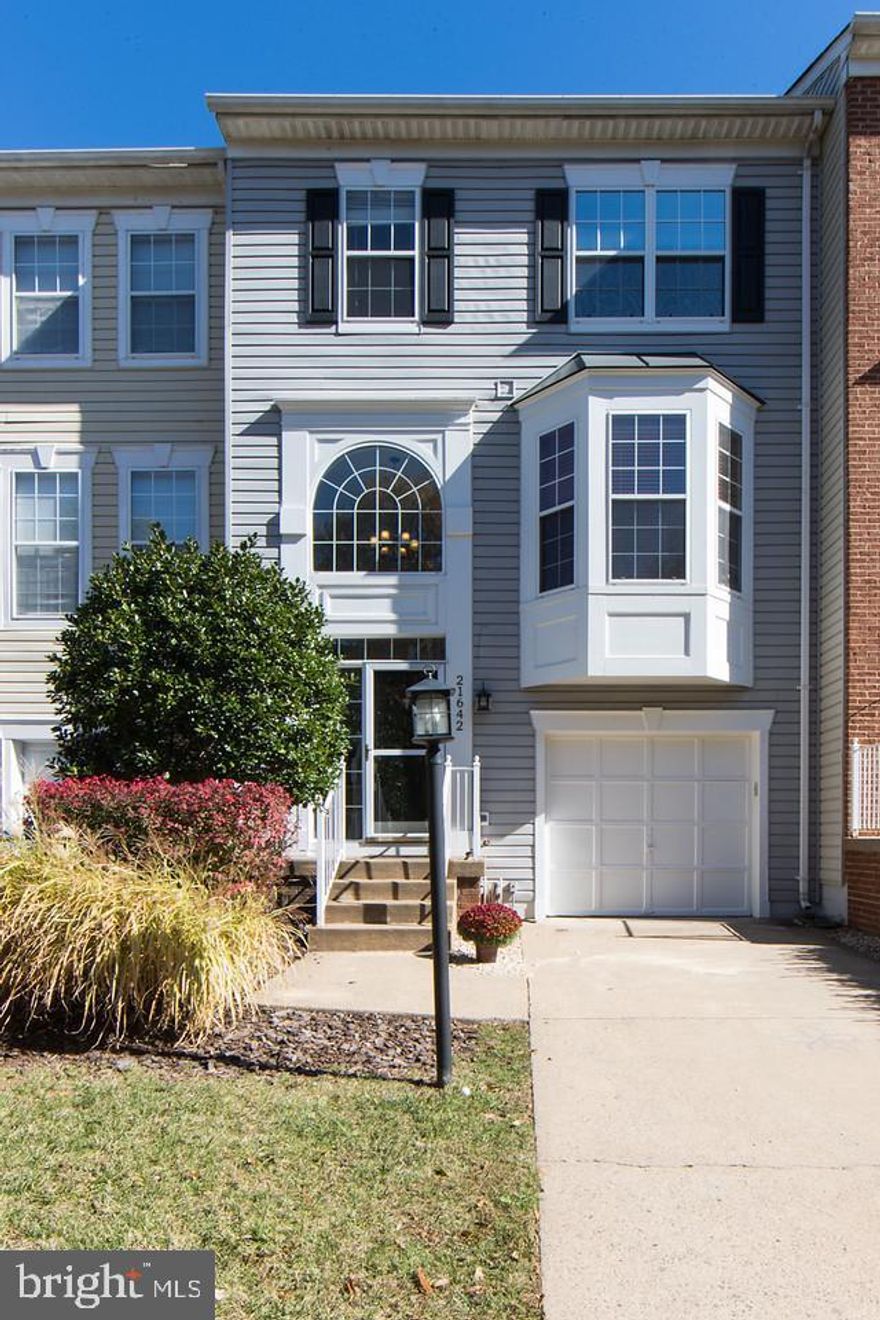 Impeccable style! Pristine garage townhome! A gorgeous home sited on a lovely cul-de-sac in a sought after community.  Enjoy a fantastic floor plan conducive to  an easy contemporary lifestyle. Stunning Brazilian hardwood floors are through out the main living level. Beautiful luxury plank flooring on the entire upper level and lower level. The large gourmet eat-in kitchen features a sizeable center island perfect for gatherings. The kitchen opens to a deck with walk down stairs to a fully fenced backyard. The master suite offers two large walk-in closets and an ensuite luxury master bath. The large family room features a fireplace to enjoy on chilly evenings.  The walk out level opens to the large backyard backing to a mature treed area. Location, location, location! Commuter's delight! Minutes to Silverline Metro.