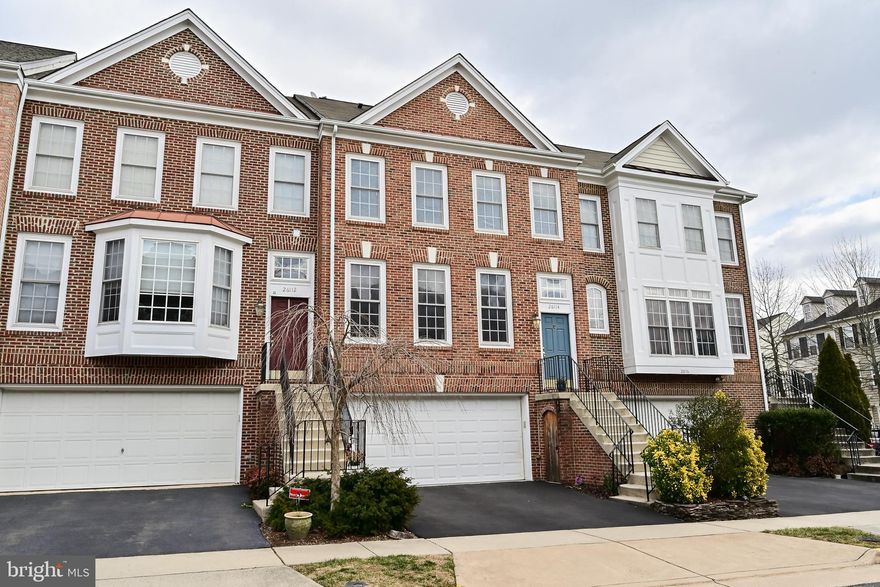 This wonderful townhouse features 2,497 sq ft, 3 bedrooms, 3.5 baths, 2 car, brick front TH.  2 level bump out.  Main level entry through garage into lower level living, full bath and bump out space.  Walk out to rear fenced in yard.  Powder on the landing/wood stairs to main floor.  Main entry on second level to Living Room & Dining Room, Kitchen with Family Room and a Huge Gorgeous Sunroom with wall of windows.  Slider to big deck.  3rd level  has Owner Suite, 2 other bedrooms, full bath and laundry!
