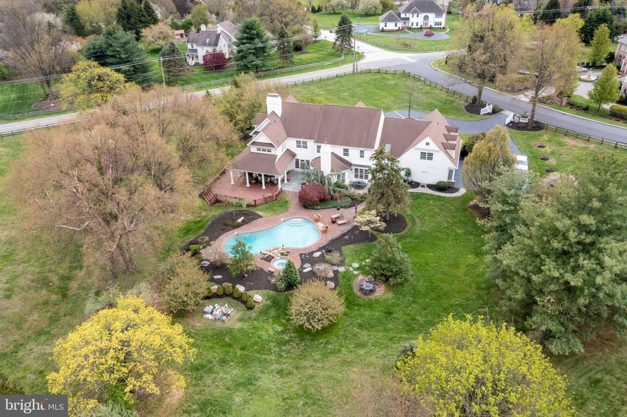 Stunning Sanctuary w/ marvelous exterior amenities that rival the updated interior! Picturesque 2 acres, nestled in sought after “Stirling Heights” w/ award winning TE schools –wonderful assets to have, while the walk-to Valley Forge Park is a feature that can’t be beat!  Enjoy life NOW & make memories that last forever - Seller can move quick & let you enjoy the Pool this Summer!  Relax on the Wrap Around Porch overlooking Pool & stone Spa w/waterfall,  see the sunset pool side or  sunrise over VF Park on MBR Porch!  Hear the Pool waterfall as you enter a grand 3 story Foyer w/ straight thru views of flagstone Patio.  Gleaming Hdwd. flrs found on entire 1st floor & continue up curved staircase - truly an architectural delight.  Raised panel surround frames the marble Fireplace in Living Rm, to right of Foyer.  Doors on both sides of LR FP lead to Library, passing window alcove w/fabulous views of VF Park.  LIB has cherry built-in shelves & cabinets, handy wetbar w/ cherry glass front cabinets & dual zone beverage fridge.  Fireplace has brick hearth & coffered ceiling adds charm.   Sliding glass door opens to Patio & wraparound Porch w/ recessed lighting & knotty alder ceiling. It's Easy to work from home here - while keeping an eye on the Pool thru triple windows in LIB.  Cedar Deck off the Porch gives room for dancing under the stars! Back in the Foyer is Powder Rm w/ marble floor. Hallway next to PR leads to spacious Dining Rm w/ wall sconces & modern champagne gold candelabra.  French Drs. lead to the heart of the home - an updated & upgraded Gourmet Kitchen every real Chef wants: 6 burner gas stove, 2 convection/steam ovens, quiet close "Medalion" custom cabinets  w/ upgraded pullout shelves, drawer organizers,  blt-in spice & baking tray cabinets & a lazy susan w/ lights inside.  Classic raised panel perimeter cabinets  are accented w/ triple crown molding & gray black stain on center island complements granite counters w/ neutral "hand-placed"subway tile backsplash w/ undercabinet lighting.  "Charging Station"/"Appliance Caddy" cabinet,  room for chairs at island & a Breakfast Table too. Large Pantry, Back Stairs, & doors to 3+ Car Garage,  Lower Level, & out to another Patio & Grill area, w/ brick walk to Pool - such fabulous flow for entertaining on a grand scale or just a few favorite friends! 1/2 wall separates KIT from Great Rm w/ stone to ceiling Gas FP & door to Patio.  2nd Flr: MBR w/2 walk-in closets, Dressing Rm, & new MBTH w/ radiant floor heat, coffee bar, fridge, bubble tub, & spacious shower. Start your day w/ cup of coffee from bar& fridge in fabulous MBTH w/ radiant floor heat!  Bedrms 2 & 3 are also en-suite w/ Baths, & Bedrms 4 & 5 are past the Laundry w/ washer, dryer, & sink & even a handy "Craft Corner" by Back Stairs.  Plenty of storage closets & pull down stairs to Attic.  Lower Level "Kid Cave" has it all - Pool Table, Dart Board, Media Rm w/ FP & full Bath, OE, Game Rm w/ ping pong, air hockey,  Big TV & leather sofas & even more room for Music making. Newer HVAC, Generator & Grand Manor Roof & Gutters.   Pass historic Landmarks like Diamond Rock Schoolhouse & Covered Bridge in Valley Forge Park & turn into gated driveway w/ stone Pillars & belgian block apron, leading over to circular drive & front flagstone walks to front & side doors, or past weeping cherry trees & many other fabulous trees & bushes.  Level front Yard is ready for LAX, Soccer, Baseball,  Football!  Stately Colonial GEM has it ALL & is conveniently located to Rts. 202, 30, & turnpike, & is mins. to world class shopping.  Sooo Ready for it's new  OWNERS to let the fun begin - All your friends will want to come visit & relax by your pool & watch Riders from  Great Scot Horse Farm pass by for miles of VF Park trails.  Incomparable  Location, Schools, & Amenities!  Some Furniture may be available & Recent price adjustment allows for new carpets of Buyer's choice to be installed prior to settlement - READY for YOU NOW!