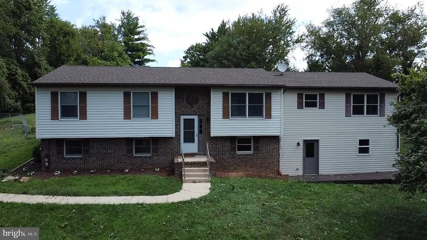 Beautifully remodeled 3 Bedrooms + 3 Large bonus rooms all with closets could potentially be a 6 bedroom. This huge rancher has over 3k sq of living space including a fully finished walk-out basement with a new kitchenette/wet bar. Bonus separate main level In-Law suite with a new full-size kitchen, laundry, separate HVAC system, and a new hot water heater. This gorgeous property features 3 oversized decks and an exclusive private setting on 1.27 acres overlooking exquisitely landscaped grounds. All 3 kitchens have 9 brand-new SS appliances and stunning quartz. Gleaming hardwood floors and new carpet throughout. Large spacious driveway and plenty of parking for cars and RVs. Big fenced-in backyard perfect for dogs to enjoy. Don't miss out on this one-of-a-kind home!