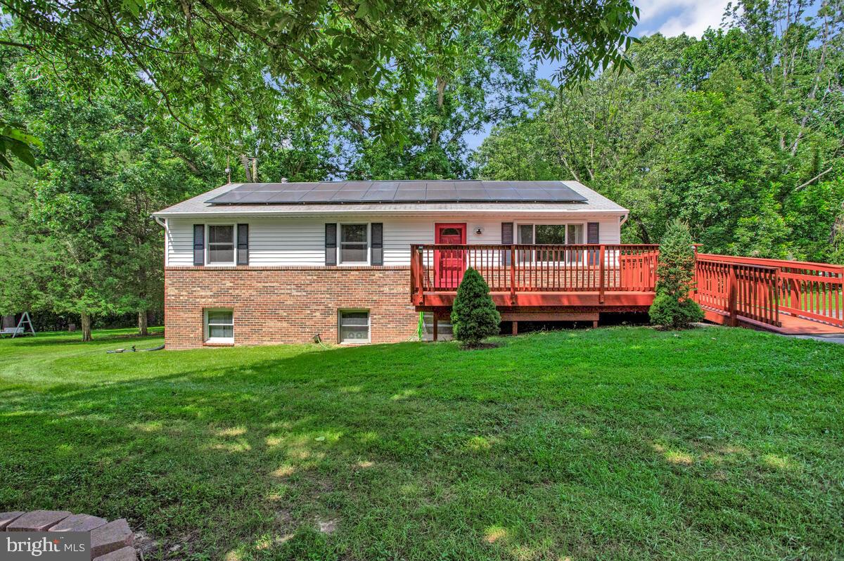 Cute 3 bedroom rambler sitting on a mostly wooded 2.67 acre lot located in Huntingtown offers a spacious country kitchen w/ dining area combo .
Main level includes fresh paint, new carpet, newer windows & front door, newer floors in dining area, hallway, and living room.
Also all 3 bedrooms & 2 full baths, including laundry area are all on main level.
Partial finished lower level has a basement apartment, that includes a kitchenette w/ table space, living room/ bedroom combo. Unfinished walk -out side of basement does provide the 3rd full finished bathroom and includes washer/ dryer hookup, lots of additional storage and could be finished to provide additional living space for everyone.
Nice size front deck has plenty of room for your cozy rockers. Back deck includes a gazebo & hot tub, with plenty of room for all your summer cookouts and a great place to relax.
Yard has plenty of space for all your outdoor hobbies and provides established trees, landscaping, fruit trees, and backs up to your woods.
Solar panels are fully paid off with no additional fees. Yay!
Property is conveniently located right off of Rt 4 and located near local shopping, dining , boardwalks, beaches, libraries, and so much more.
Less then a hour commute to Pax River Navel base, Andrew’s Air Force, Annapolis, DC, and Baltimore but with all the Calvert has to offer.