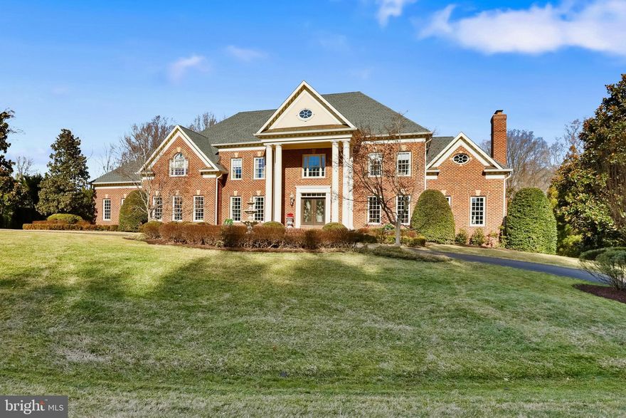 Exceptional custom-built estate situated on a private 1.72-acre lot in an exclusive cul-de-sac with no HOA in the heart of McLean, Virginia. This all-brick masterpiece, built in 2002, offers an expansive 10,800+ square feet of luxurious living space, featuring six spacious bedrooms, each with its own private en-suite bathroom, and an additional half bath for guests. Designed for both elegance and comfort, this residence blends classic architectural details with modern amenities, creating a one-of-a-kind retreat.  

As you step through the grand entrance, you are welcomed into a stunning two-story foyer, highlighted by a majestic double staircase, custom tray ceilings, and elaborate moldings that exude timeless sophistication. The main level features a first-floor primary suite, offering ultimate convenience with a private en-suite bath and walk-in closet—perfect for multi-generational living or guest accommodations. The formal living and dining rooms, adorned with intricate millwork and soaring ceilings, provide an inviting space for entertaining.  

At the heart of the home, the gourmet kitchen is a chef’s dream, boasting a large center island with a breakfast bar, sleek stainless steel appliances, custom cabinetry, and an open breakfast area that flows seamlessly into the expansive family room with a cozy fireplace.  

The upper-level grand primary suite is a true sanctuary, featuring a spacious sitting area, two oversized walk-in closets, and a lavish spa-inspired en-suite bath complete with a soaking tub, dual vanities, and an oversized walk-in shower. Each additional bedroom on this level is en-suite, offering private full bathrooms and generous closet space, ensuring the utmost privacy and comfort.  

The fully finished lower level is designed for entertainment and leisure, boasting a custom full bar, a state-of-the-art media room with luxurious leather seating, a fitness center, and expansive recreational spaces. French doors lead to the beautifully landscaped backyard, offering endless possibilities for outdoor enjoyment, with room for a pool, sport court, or outdoor kitchen.  

Located just minutes from Tysons Corner, major commuter routes, top-rated schools, and premier shopping and dining, this extraordinary estate delivers an unmatched combination of grandeur, comfort, and exclusivity. With no HOA restrictions, you’ll enjoy the freedom to personalize your home as you desire.  

Experience refined luxury and timeless elegance at 8896 Olson Court—an unparalleled residence in one of McLean’s most coveted locations.