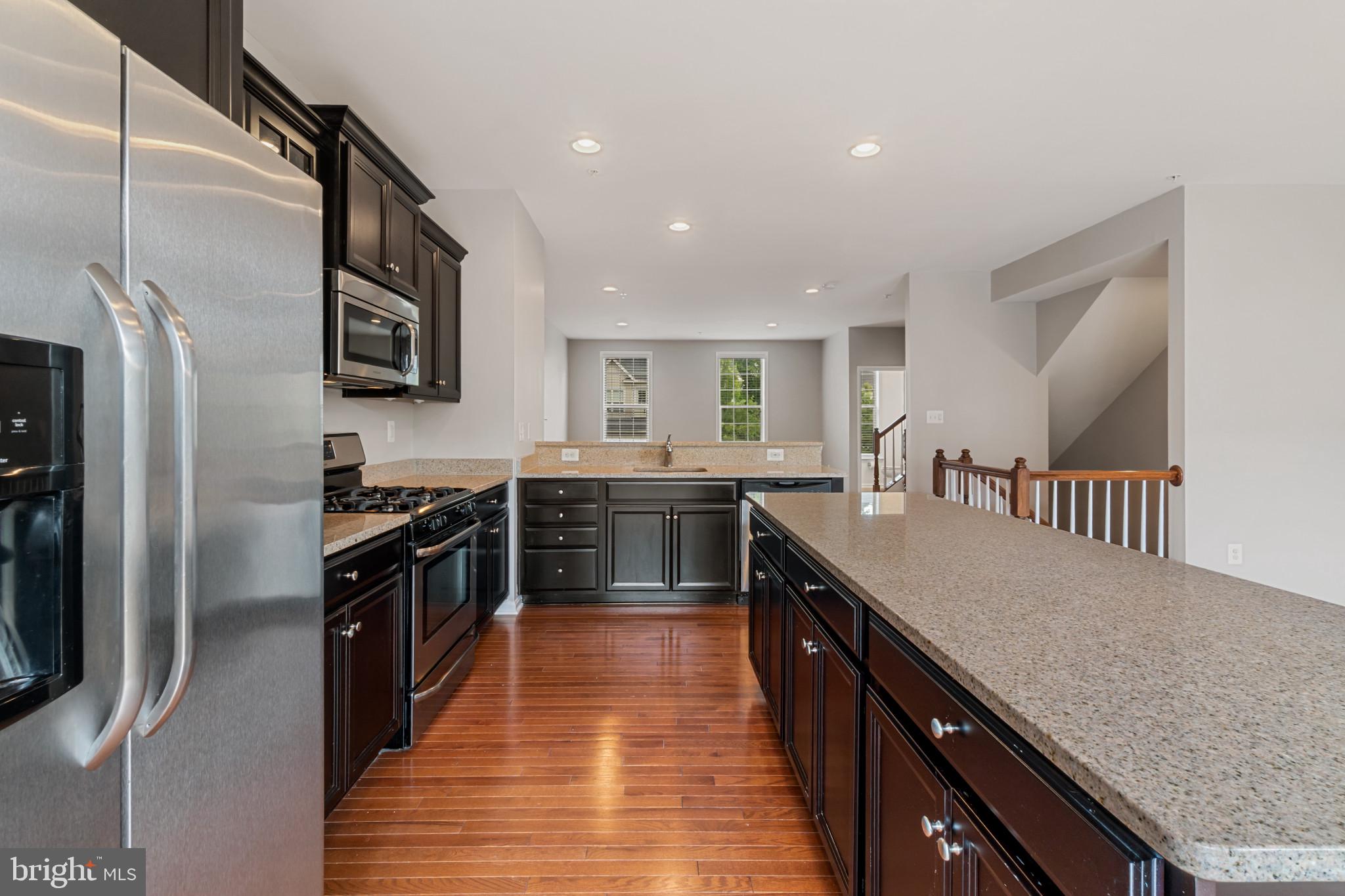 This beautiful Townhome has just been renovated and is located in the Thriving Canterbury Village Community Has it All! Fresh Paint, and new flooring you will surly LOVE !!! 4 Bedrooms, 2 Full and 2 Half Baths, Attached 2-Car Garage, and the Open Concept Main Living Area is Perfect for Entertaining! A Sun-Filled Gourmet Kitchen Awaits You with a Center Island, Sparkling Granite Countertops, Sleek Stainless Steel Appliances, Breakfast Bar, and Includes Plenty of Space for Your Morning Breakfast Table. Open the Sliders to the Rear Deck, the Ideal for Spot for Your Grill! Make Your Way Upstairs to Find a Lofty Primary Bedroom with Ceiling Fan, Walk-In Closet, and Attached Bath. The Primary Bath Features a Jetted Soaking Tub, Dual Vanity, and Stand-Up Glass Enclosed Shower. Two Additional Bedrooms and a Full Bath Rounds-Out the Upstairs. The Main Entrance on the Lower Level Is Complete with a Half Bath and Large Finished Recreation Room w/ Walk-Out To Your Private Fenced Yard. This Perfect Home is Not to Be Missed!