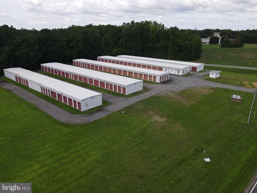 Discover a versatile commercial opportunity with Louisa Self Service Storage Inc, offering 175 secure storage units ranging from 3x5 to 10x25. The facility offers 197,850 square feet, with a net rentable area of 20,700 square feet that was constructed in 1988. In 2024 a new roof was installed, along with other items. This C2 zoned 4.54 acre parcel has potential for expansion, with roughly 1.79 acres currently not used. Conveniently positioned between the Town's of Louisa and Mineral, this storage facility presents excellent investment opportunities in a rapidly growing County.