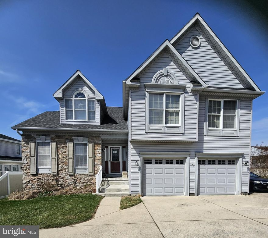 This charming Colonial split-level home in the desirable Ramblebrook community offers a perfect blend of comfort and style. With five spacious bedrooms and three and a half bathrooms, there's ample room for relaxation and entertaining. The heart of the home features a beautifully upgraded kitchen with an island, double ovens, and a cozy eat-in area, seamlessly connecting to the family room-ideal for gatherings. Elegant crown moldings and chair railings enhance the formal dining room, while the inviting living family room boasts a gas fireplace, perfect for cozy evenings. The partially finished basement provides additional living space and a side entrance, offering versatility for your needs. Enjoy the convenience of a laundry area and a two-car garage with inside access. With hardwood floors, recessed lighting, and walk-in closets, this home is designed for modern living. Step outside to an enclosed deck, covered patio and large back yard, ready for you to create lasting memories. Experience the warmth and charm of this delightful residence!