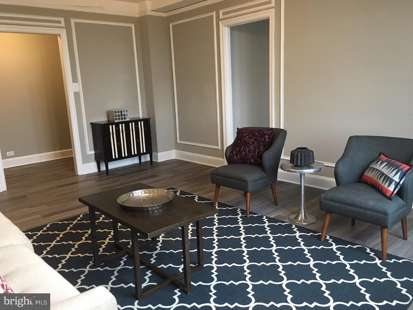 BRAND NEW FULLY RENOVATED—Corner three bedroom plus dining room, two bathroom with amazing natural light and 270 degree city views. Updates include beautiful grey hardwood-like floors, new bathrooms, and a brand new kitchen with contemporary wood cabinetry, stainless steel appliances, and granite countertops. The residence features a large living room off of the foyer, a separate dining room, a large kitchen, and a stackable washer and dryer. The Carlyle is a pet-friendly, doorman building only one block from Rittenhouse Square. Rent includes the security of a 24-hour doorman and use of the building's state-of-the-art gym. Electric, gas, and water are all based on square footage. Tenants pay cable and internet.