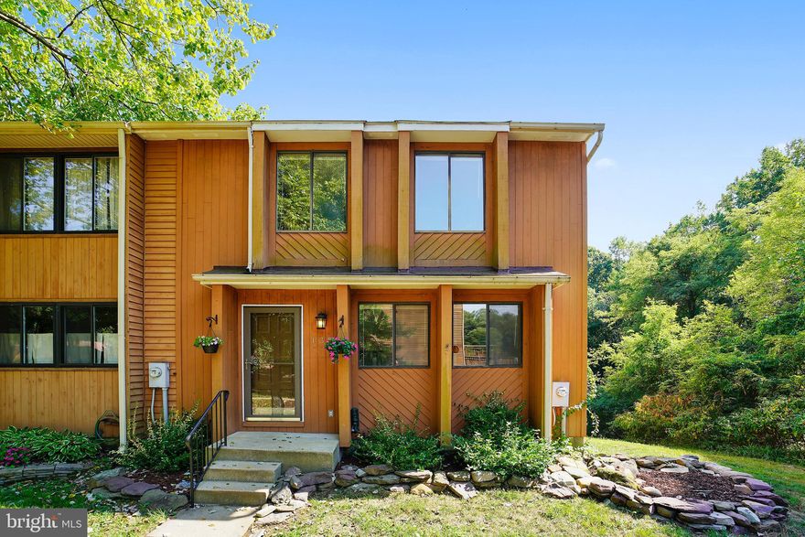 Premium end unit location with wooded privacy on 2 sides!  Full-length deck with stairs to large fenced back yard / Tasteful new kitchen cabinets, counters, fixtures, deep sink, garbage disposal, smooth surface range with overhead microwave, and dishwasher / Low maintenance flooring on main level / Skylight in Master bedroom and hall bath / Renovated Master Bath / Completely open, full walk-out, basement with great future potential / 2 assigned and shaded parking spaces / low HOA fees / Immediate access to Route 50 / Cape St. Claire shopping center only .7 miles away! / Sold AS IS