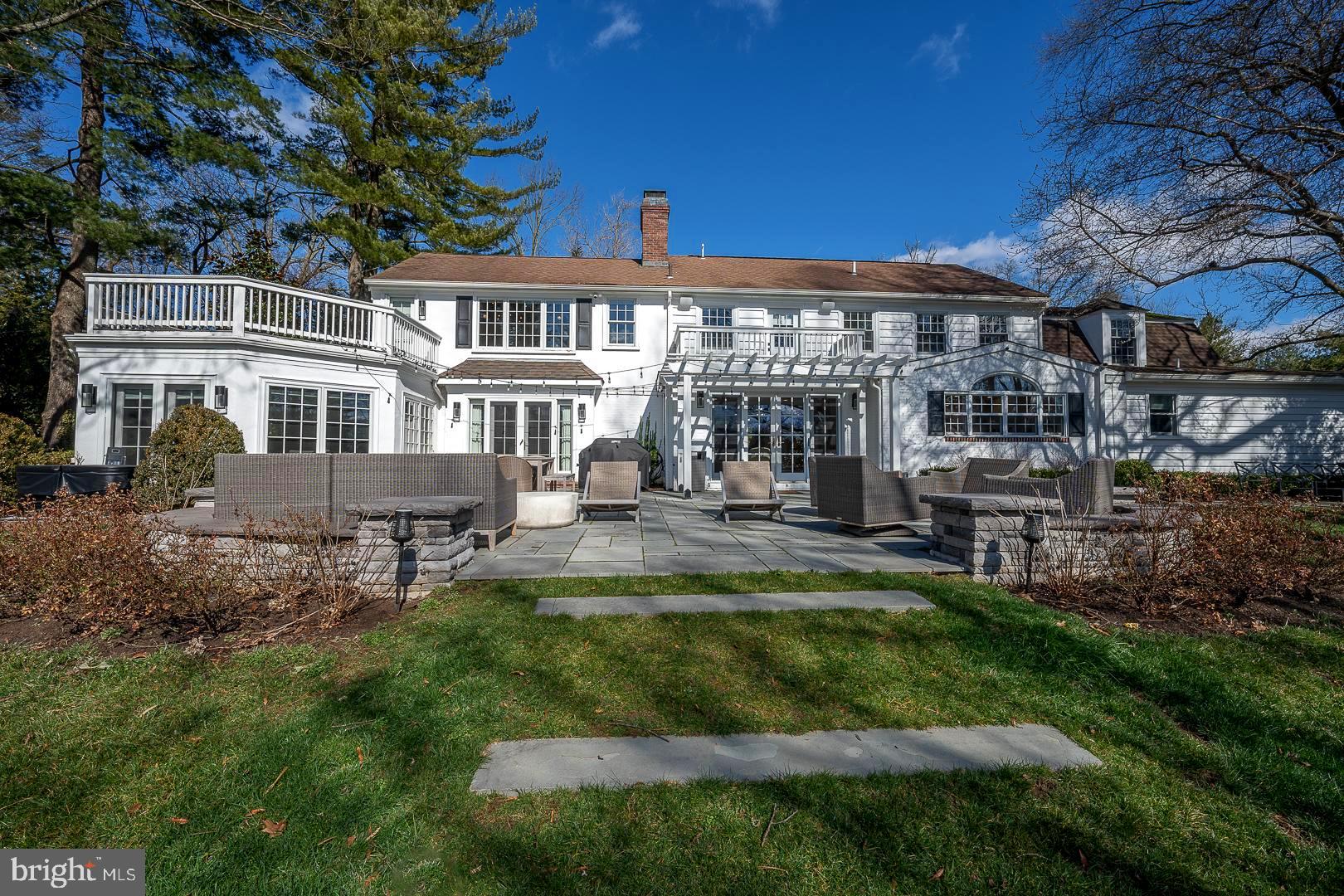 This gorgeous, Renovated, Gladwyne Farmhouse sitting on 1.37 acres is a must-see! Featuring high-end finishes, beautiful hardwood floors and the perfect blend of traditional and contemporary design, this 5-bedroom, 4-and-a-half bath home has it all. The formal living room with a stunning fireplace is both cozy and elegant and is flooded with light from the French doors to the backyard. Sitting off the living room is the sunroom perfect for a sitting area or office. The formal dining room with French doors to the back patio, sits off the kitchen, ideal for hosting your next dinner party. The gourmet kitchen with top-of-the-line appliances, concrete counters, a large island, and tons of storage and workspace flows in the breakfast area with a built-in bar area with a beverage fridge. The huge family, which is currently a playroom, sits off the kitchen and is the perfect reading spot with built-in bookshelves and a window seat overlooking the luscious grounds. Completing the 1st floor is a bedroom/office and full bath both with access to a private patio as well as a convenient half bath and an oversized mudroom with cubbies and storage. Ascend the stairs to the 2nd floor where you will find the fabulous primary suite with a large bedroom with a sizeable balcony, an enormous walk-in closet, a full ensuite bathroom with a soaking tub, a double vanity, and a large, custom walk-in shower. A converted bedroom is the primary walk-in closet with custom built-ins and a private balcony. Three additional bedrooms, 2 full bathrooms, and a laundry room complete this level. The finished lower level is perfect for a recreation room, and fitness space and offers tons of storage. Escape to the backyard oasis with a slate patio, inground pool, and beautifully landscaped grounds. Located in the Award Winning Lower Merion School District. This hidden gem provides both privacy and convenience with its walkability to the Village of Gladwyne and easy access to major roadways. This home is truly move-in condition on one of the nicest, sought-after streets in Gladwyne.