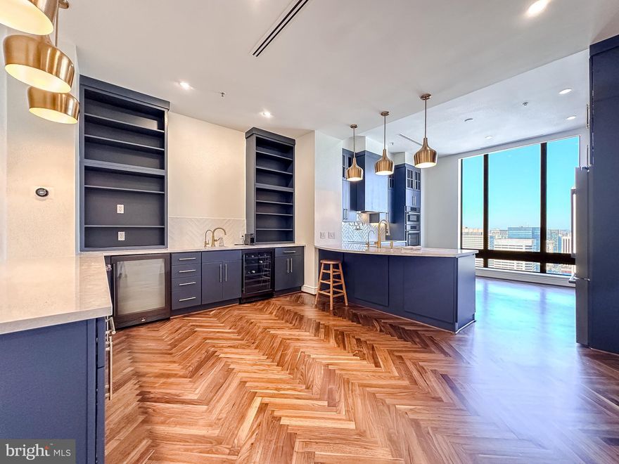 Welcome to luxury living at its finest in this stunning four bedroom, four and a half bathroom penthouse condo within the prestigious Towers at Harbor Court. Boasting an open concept floor plan adorned with elegant chevron pattern floors and twelve foot ceilings, this residence offers unparalleled sophistication. Revel in the mesmerizing vistas of the Inner Harbor from expansive windows throughout the unit. Recently renovated, the home showcases a brand new gourmet kitchen complete with stainless steel appliances and a chic bar/breakfast area, perfect for both intimate gatherings and grand entertaining. Enjoy the epitome of urban elegance in this exquisite waterfront retreat. Experience the unparalleled service with 24/7 front desk staff and a dedicated doorman providing seamless assistance at your fingertips. Enjoy the convenience of reserved parking and ample storage space for your belongings. Stay active and rejuvenated with access to the state-of-the-art fitness center, or bask in the sun by the pool with a membership available for residents. With a plethora of amenities designed to enhance your quality of life, this residence embodies the essence of urban living in the heart of Baltimore's Inner Harbor.