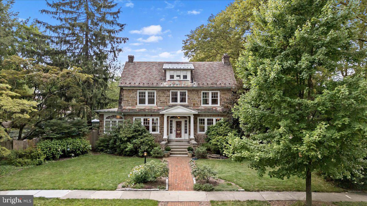 Nestled among the mature, tree-lined streets of Allentown’s coveted West End, this stately 1928 Colonial blends timeless elegance with modern comfort. Overflowing with charm, character, and architectural beauty, this classic home offers sun-drenched living spaces and gorgeous H/W floors throughout.Step inside and be welcomed by the warmth of a grand parlor featuring a stunning double-sided stone FP, shared with a versatile sunroom—ideal as a cozy library, music room, or reading nook. Opposite the parlor, a generous formal DR opens into another sunroom currently used as a breakfast area, but perfectly suited as a bright and inspiring home office.The sleek KIT is thoughtfully updated with SS finishes, new appliances, and a deep window sill, offering easy flow to both indoor and al fresco dining areas. A powder room and convenient laundry room complete the main level.At the heart of the home, a remarkable 3-story staircase with ornate wood railings leads to the spacious upper levels. The 2nd and 3rd floors feature 5 BRs, adorned with original wood doors, curved windows, dormer wall accents, and custom built-ins. 3 full BAs maintain the home’s historical appeal while providing modern function. Outside, enjoy your own private oasis—perfect for entertaining.Located just blocks from Allentown’s vibrant theatre district, farmers market, and the excitement of the Great Allentown Fair, this exceptional home also offers convenient access to major thoroughfares.OPEN HOUSE SUNDAY 1–4 PM!