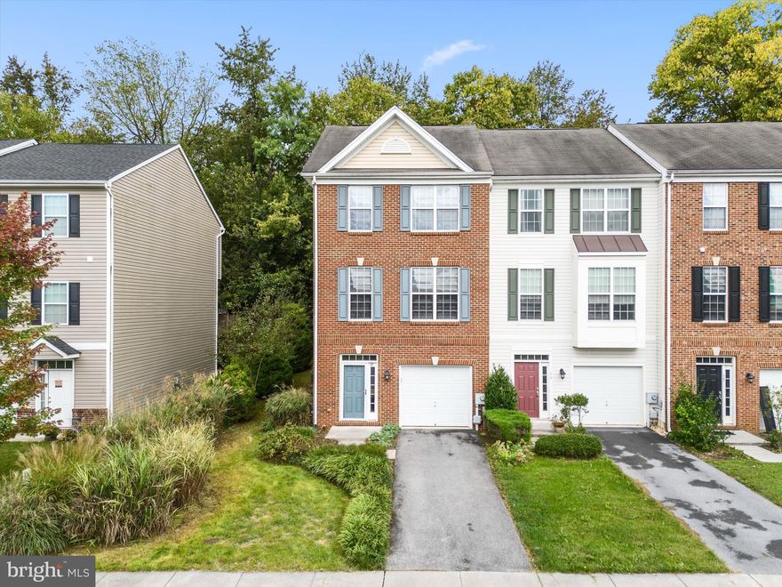 $10K PRICE REDUCTION! This brick-front end-unit townhouse is located just outside Historic Shepherdstown in the Colonial Hills community. Featuring three finished levels, the home boasts an open floor plan highlighted by LVP flooring, stainless steel appliances, Corian countertops, and custom plantation shutters. Enjoy outdoor privacy on the rear deck, which overlooks a serene treeline.
The entry level includes a large foyer, bonus room, half bath, and laundry room. On the living level, you'll find an inviting eat-in kitchen that flows into the adjacent bonus room, dining room, and family room, creating the perfect space for gatherings.
Upstairs, the primary suite offers a cozy sitting area, a spacious walk-in closet, and an en suite bath complete with dual sinks, a stall shower, and a soaking tub. Two additional guest bedrooms share a well-appointed hall bathroom, making this level perfect for family or visitors.
The property also includes a one-car garage and two driveway spaces. With easy access to Morgan Grove Park, shopping, schools, and Shepherd University, this townhouse combines comfort and convenience in a desirable location. Schedule your appointment to see it now!