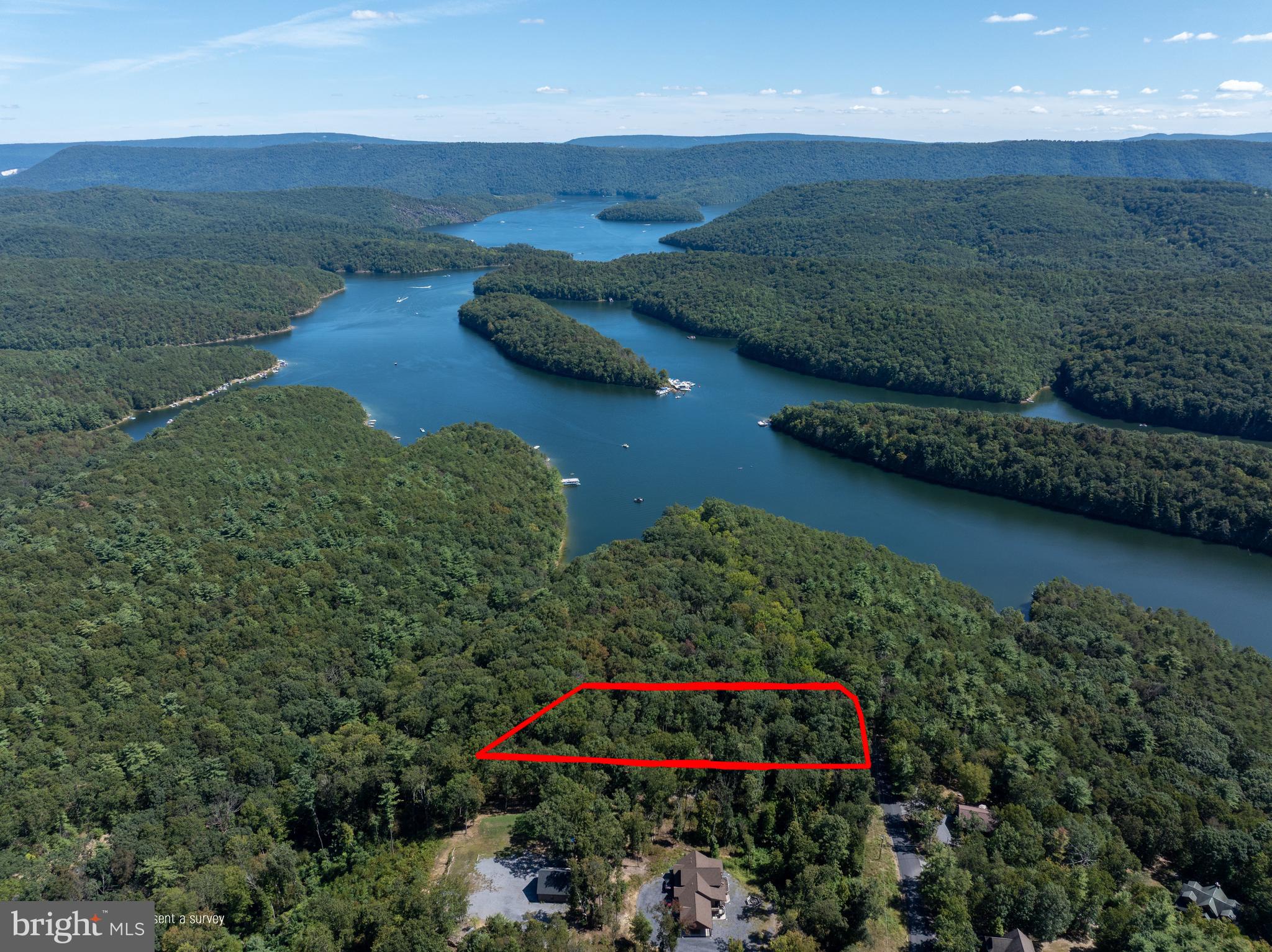 WATERSIDE LOT - Discover the perfect opportunity to build your dream home (renderings in post with building ready to start) on this stunning waterside 2.04-acre lot! The property next to this just sold for $1,050,000, lots of value here. This land is perced for a 6-bedroom home, this property offers unparalleled access to nature, sitting just 150 yards from the lake with only federal parkland in between. Enjoy unrestricted access to walk straight to the water, making it ideal for lake lovers and outdoor enthusiasts. Don’t miss out on this rare lakeside opportunity!