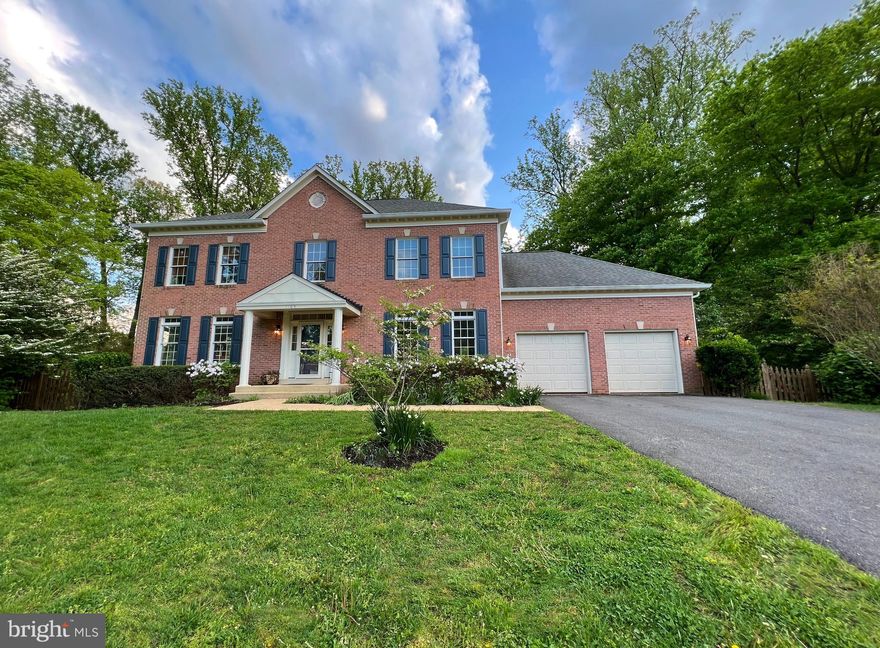 Outstanding brick-front CUSTOM contemporary Colonial 3-level home on almost half an acre, tree-framed lot in sought-after 'Hersands Addition' offers a quiet park-like setting in the Town of Vienna with WALKING DISTANCE to the Vienna/GMU Metro and membership to the Vienna Aquatic Club (Go Gators!) This gracious 5,000+ sqft open concept modern floorplan, with 5 bedrooms and 4 full bathrooms plus a main level half bath, was designed for entertaining, from the oversized elegant formal living room, with space for a grand piano, to the impressive banquet-sized separate dining room, which opens to the fabulous gourmet kitchen with Italian granite counters, island, and breakfast bar overlooking the bay window sunroom. The family great room features a cozy brick fireplace and a French door to the spacious deck for evenings grilling out under the stars! The main floor has a private library off the great room, ideal for working from home! The original owners are listing this well-maintained home following thoughtful updates, including a new architectural shingle roof, tone-on-tone interior painting, and upgraded carpeting on the top bedroom level. Extra high ceilings, extensive crown & chair rail molding, and gorgeous light oak hardwood floors welcome your friends and family to the gracious 2-story front foyer.  Up the pretty turned staircase, is the owner's private wing featuring a stunning tray ceiling and a private Juliet balcony overlooking the beautiful tree-framed backyard. The owner's suite has double 5ft walk-in closets and a spacious en suite bathroom with double vanities, a luxurious soaking tub, and a large shower. This top-level offers 3 additional spacious bedrooms, each with generous closet space and an attached full bathroom! The lowest level is the perfect place to watch the big game or movies in the 2nd family room. This level has a large game room (bring the pool table!) 2 extra-large storage rooms and an incredible 5th bedroom/in-law/au pair/guest suite, a private sitting area, and an attached full bathroom. This walkout basement has a French door to the finished patio in the fully fenced backyard. This yard is a gardener's dream! Gorgeous azalea bushes, lilac trees, dogwood, and flowering viburnum welcome Spring! The side yard has an organic garden and fruit trees - truly a nature sanctuary to enjoy every season. This quiet private enclave of lovely homes is not in an HOA! The location is outstanding, from the many commuting options (especially the ability to walk or bike to the Metro!) a quick drive to I-66, I-495, Rt 123/Tysons Corner, Mosaic, Dulles Airport, and the Reston Tech Corridor, this close-in location offers a lifestyle without compromise! The award-winning school district includes Marshall Elementary, Thoreau Middle, and Madison High School. This is the home you have waited to find - Welcome HOME to 1105 Trowbridge Lane in the charming Town of Vienna!