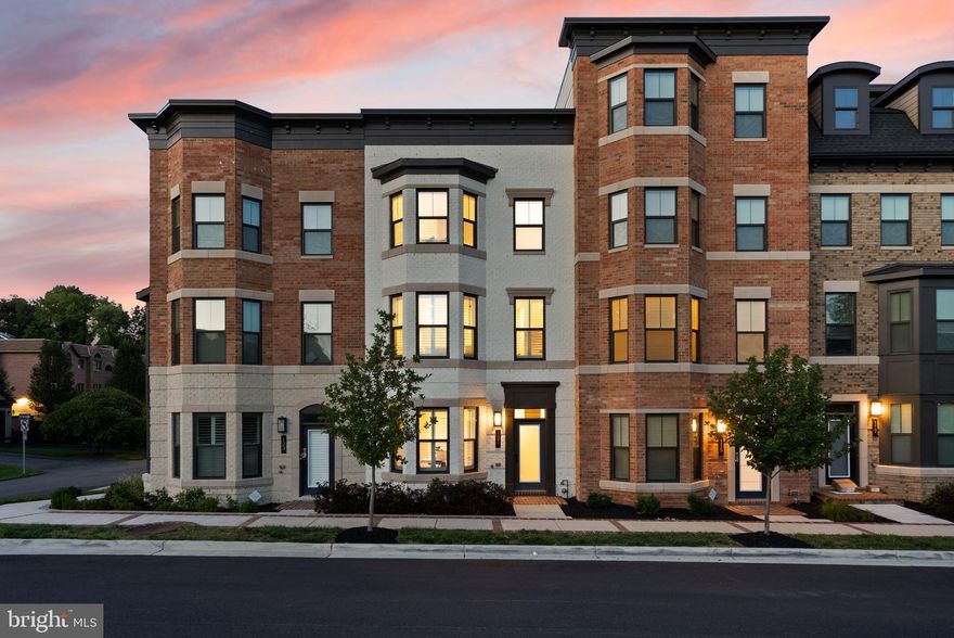 Step into this incredible home that perfectly blends luxury and convenience right in the heart of Vienna! This lovely residence in Vienna Market Square offers a beautiful mix of modern design and top-notch features with high ceilings throughout.

As you explore the home, you'll find a versatile space on the entry level, perfect for a home office or cozy bedroom, complete with a full bathroom and upgraded luxury vinyl flooring. The main level features open and inviting living areas, including a gorgeous gourmet kitchen with quartz waterfall countertops, upgraded appliances, and a family room with a sunny bay window. The dining room is a real treat with its stylish chandelier and built -in butler's pantry complete with wine fridge and metallic penny tile backsplash, Don't miss the charming covered balcony with a toasty gas fireplace with gorgeous stone surround. 

On the third level, you'll discover the luxurious primary suite with a spa-like bathroom complete with custom closet built-ins, a spacious secondary bedroom with its own bathroom, and a convenient laundry area. The fourth level boasts an additional 800 square feet rooftop patio. An Entertainers dream oasis awaits you!  Plus, the finished two-car garage comes with plenty of built-in storage.

This amazing home comes with over $100,000 in builder options and an extra $40,000 in owner-installed upgrades like the Butlers pantry, closet systems, lighting and of course the custom shutters and window treatments!, This house is completely move-in ready. From the kitchen cabinets and drawers to the  garage , this home has been outfitted with professionally installed storage systems from The Container Store .

This house is situated in the highly sought-after Madison High School pyramid, it's also just a stone's throw away from shopping centers, town of Vienna's award winning restaurants and walking distance to Whole Foods. Close major commuter routes. The Vienna-GMU Metro Station and Route 66 are just two miles away, and the Silver Line at Tysons Corner is three miles away.

If you're searching for a stylish and welcoming home in the heart of Vienna, then this is the one for you!