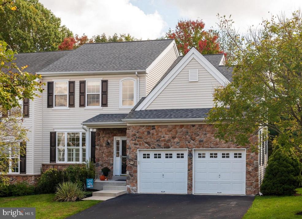 **PRICE DROP ** This gorgeous, semi-detached neutral palate carriage style home in the private neighborly community of Green Lane Village, welcomes you home in West Chester with 3 bedrooms and 2.5 bathrooms. Walking up, you will find a built-in 2 car garage, strategically placed landscaping, and a mix of masonry and vinyl paneling on the exterior. A small exposed porch will make for a great display of plants, or relaxing in a rocking chair. As you enter the home, you are greeted with high ceilings and a chandelier in the foyer. To the left, a spacious living room and dining room area is sectioned off by 4 large white columns making for a regal display. As you keep walking, you will feel the plush and recently conditioned carpet comfort your feet throughout the home. Further down the hall, you will notice that the kitchen, family room and eating area have an open layout which is ideal for entertaining. Kitchen appliances like fridge and dishwasher have been updated to modern stainless steel. Family room holds a gas fireplace to keep yourself cozy during fall and winter months and many rear facing windows for natural sunlight. The main floor is completed with a powder room, inside access to the garage and awesome low maintenance trex-like deck off of the eating area. Huge deck with stairs to the yard has additional privacy due to strategically placed trees and landscaping. The second floor is arranged with 2 spacious bedrooms that boast a jack and jill bathroom. 1 large primary suite offers vaulted ceilings, ample closet space, large jetted tub and separate glass shower. Each bedroom has remote control operated ceiling fans. Convenient second floor laundry area caps out this floor. The basement is clean and unfinished with shelving and an extra enclosed room which has the potential to be used for storage or office. Home boasts natural GAS heating, cooking and dryer. HOA takes care of exterior building maintenance including roof, driveway, siding, walkway, grass cutting, snow removal. Sellers spent quite a bit of time in Florida, especially during the winter months; the systems in this home were probably grateful for that! New HVAC (October 2020)