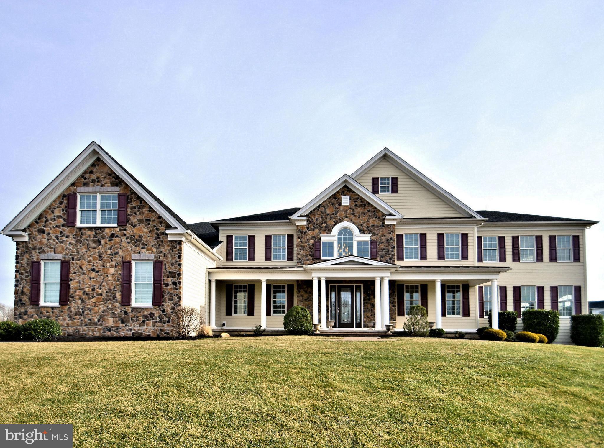 Situated perfectly on over one immaculately maintained acre sits this spectacular Henley Stone/Hardie Plank model, Toll Brothers most popular floor plan. Located in one of Newtown s most sought after and prestigious communities, Chapman s Corner, this home offers the discriminating buyer a wide array of luxury, comfort and construction features, and is in mint, move-in condition. Enter from the covered front porch to the soaring two story foyer featuring dual curved staircases with iron balusters, gleaming hardwood and gorgeous marble flooring. Impressive 10 first floor ceilings, detailed crown and box moldings are featured in the living room and formal dining rooms, each with tray ceilings. French doors will lead from the LR to the giant conservatory, with 12 ceiling and walls of windows. The gourmet kitchen is a chef s delight, featuring a large triple tiered center island ( with seating for 6 ), beautiful stainless-steel appliances including 6 burner stove and gridle, two full ovens, bread oven and microwave, side by side refrigerator freezer. Granite counters, tumbled stone flooring & backsplash, walk-in pantry, triple window over the sink, 3 total sinks, wine cooler, tons of cabinet space, expanded breakfast room with skylights, and triple French doors leading the patio & pool, and rear staircase access make this the most spectacular kitchen on the market today. The two story family room features floor to ceiling stone fireplace (gas) and gorgeous box trim ceiling. A sixth bedroom ( could also be used as a home office ) with full bath, laundry room and powder room complete the first floor. This customized floor plan was designed for maximum entertaining and large holiday and family gatherings. The upper level, with 9 ceilings features four additional bright and airy bedrooms with large closets and ceiling fans, as well as the luxurious Master Suite consisting of a large sitting room, main bedroom with coffered ceiling, incredible Master Bath with oversized shower, jetted tub, 3 large walk in closets and exercise retreat. The lower level features a walk out, rough-in plumbing and offers the opportunity to add your personal design and finishing touch. The paver patio with built in grill, in-ground pool, and large area for field sports add to the resort like feel of this home and offer the ultimate in privacy and amenities. All carpeting throughout is new, 3 car garage, back-up generator, 5 zone Heat/AC, GE light system, irrigation system, security system & more. Located just minutes from Newtown Boro, New Hope, and Doylestown in the heart of the Council Rock School District. **Showings start on Sunday, February 9 at the Open House from Noon - 3:00PM**