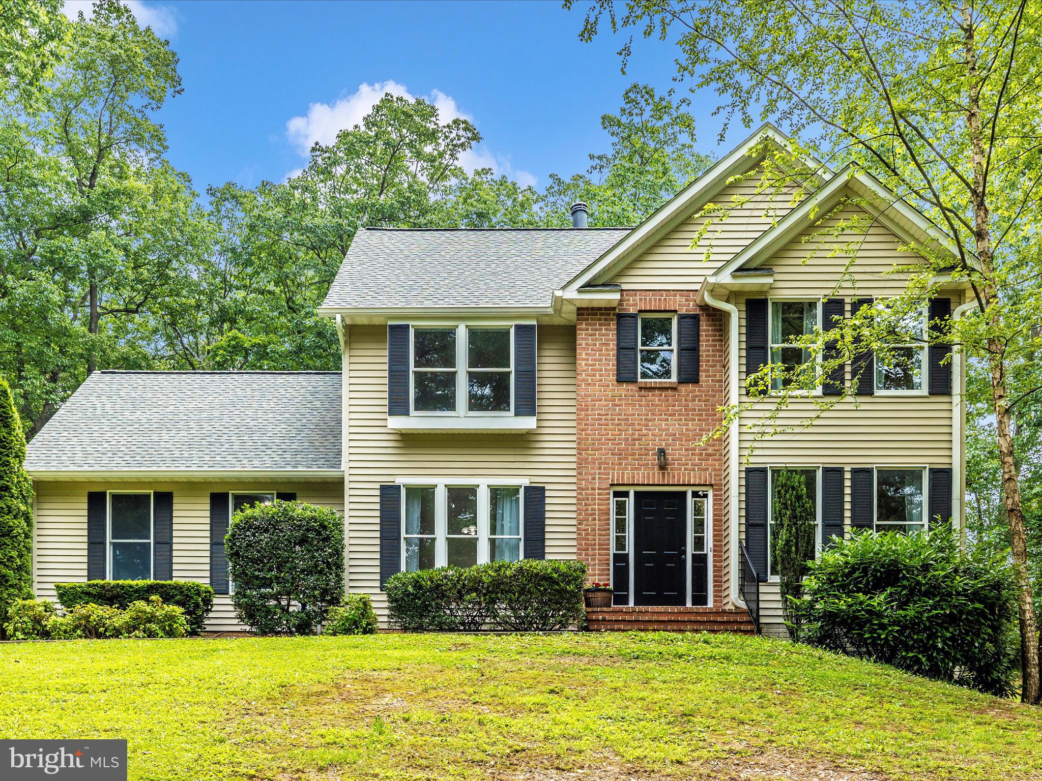 Welcome to Your Private Retreat on 3.85 Wooded Acres! Get ready to be wowed by this beautifully maintained home, perfectly tucked away for privacy and outdoor enjoyment. Host unforgettable gatherings in the enclosed screened pavilion, ideal for entertaining in every season. Inside, the main level boasts a gourmet kitchen that is a chef’s dream—featuring an oversized granite breakfast bar, a center butcher block island, Viking gas cooktop with hood, an additional electric range, custom cabinetry, stainless steel appliances, a pantry, and recessed lighting. Open concept connects the kitchen, breakfast area, family room, and a cozy sitting room with built-in shelves flanking a wood stove—perfect for relaxed evenings. Need more space? The formal living and dining rooms offer flexible use for entertaining, a home office, or a playroom. A large mudroom with laundry room connects to the 2-car side-load garage, which includes a 220V outlet for EV charging or workshop tools, plus a convenient side yard exit. Upstairs, you'll find 4 spacious bedrooms and a full hall bath. The primary suite offers two walk-in closets, a dual vanity, a separate shower, and a soaking garden tub. The partially finished lower level includes a game room and a large unfinished section with a 3-piece bath rough-in, workshop space, and walk-out access to the side patio—offering plenty of room to grow, play, and store. Outside is nice and private featuring a backyard patio, mature trees, far back off from the road, some cleared grassy space around the home, a parking pad off the driveway, and the entertainment area with horseshoe pit behind the pavilion! The owners have maintained this home throughout and is a gem to see in person. Some highlights: the Roof was replaced 5 years old; Shed Roof replaced 9 years old; complimentary 1 Year Cinch Home Warranty included for extra peace of mind.