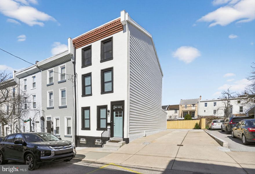 Welcome home! Three bedroom, two and a half bath home in the heart of Manayunk. This complete rehab has been transformed by CCS from the bottom up. The first floor offers ample living space including living room, dining space and a kitchen as well as the homes half bath and dedicated laundry space. The kitchen includes a custom tile backsplash, quartz countertops and upgraded stainless steel appliances. The double lot provides outdoor living space, rear yard and a driveway with PARKING for 4+ cars. Access to the basement from the first floor allows for ample storage. The second floor has two bedrooms and a full bath.  On the third floor you will find the homes spacious master suite with private bath and plenty of closet space. Custom paints, unique design features, LED bulbs, caged ceiling fans and high-efficiency heating/AC units providing year-round low energy costs are just a few of the upgrades. Conveniently located minutes from Main Street Manayunk, Center City, major highways and public transportation.