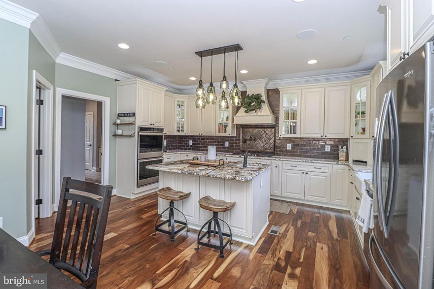 Experience unparalleled modern living in this stunning home, featuring smart switches controlled via Z-Wave through the Homeseer central hub for seamless app management. The house boasts nine zones of in-ceiling wired speakers, pre-wired audio/TV connections, and permanent outdoor under-soffit lighting, all smart-controlled for year-round customization. Enjoy smart-controlled pathway and garden LED lighting, and four-zone kitchen cabinet lighting. Security is enhanced with seven exterior and one interior wired camera, all app-controlled. The home also features a smart garage door opener, Ecobee smart thermostats, a state-of-the-art home theater with 7 in-wall speakers, a ceiling hideaway screen, and a 4K Epson projector. Additional amenities include smart window blinds, a smart Whirlpool double oven, Ethernet/cable jack combos in all bedrooms, concealed in-wall conduits, energy-efficient lighting, soundproof insulation between floors, and Tesla solar panels with battery backup for complete home power.” Also enjoy wildlife in your own backyard whitetail deer, turkeys and squirrels. Home security by Guardian