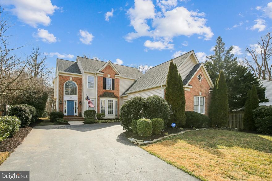 Exquisitely updated throughout. Nestled on a quiet cul-de-sac, this distinctive 4-bedroom, 4.5 bath home is gracefully appointed with an abundance of striking design features.  The warmth of the hardwood flooring welcomes you into this open concept main level and will instantly lure you through to the wall of windows in the living room which overlook a beautiful flagstone patio and allow the natural light to illuminate this gorgeous space.  On a chilly day you can relax in this light-filled space with the ambiance of the gas fireplace while you're preparing your favorite meal in the strikingly renovated kitchen, which is adjacent to the living room and flanked by a breakfast area  and formal dining area.  The kitchen is a cooks dream with stainless steel appliances to include: a gas five-burner cooktop, dual wall oven, French door refrigerator, plenty of counter surface for meal preparation, beautiful white cabinetry, and tons of storage.   The kitchen island offers casual dining, or work space, at the kitchen bar, or maybe even a spot for your guest to enjoy a glass of wine from the wine fridge!  As the warmer days roll back around, you'll find yourself enjoying the back patio and deep backyard.  During these days of Zoom meetings, home-schooling, hybrid learning, and working from home, you will appreciate the dedicated office and separate study located on either side of the living room.  Upstairs you will find four spacious bedrooms, two ensuite and a third full bath in the hallway.  All three bathrooms are beautifully updated but it's the spa-like allure of the primary suite which may have you wishing you never have to leave this private sanctuary.  With two walk-in closets, two vanities, a stand alone soaking tub , and a frameless glass enclosed shower, there is plenty of room for both of you. The lower level has an expansive rec room, a fourth full bath, room for an office or guest room, and a viewing room that is already wired for sound! There are so many details throughout this thoughtfully designed floorplan, which elevate the living experience of this home; crown molding, chair rail molding, recessed lighting, ceiling fans, soft neutral colors, abundant storage, spacious rooms, with a coziness not often found in a home this size (5000+ SF).  Open houses: Sat / Sun, March 20 & 21.  Masks required & please be prepared to remove your shoes.