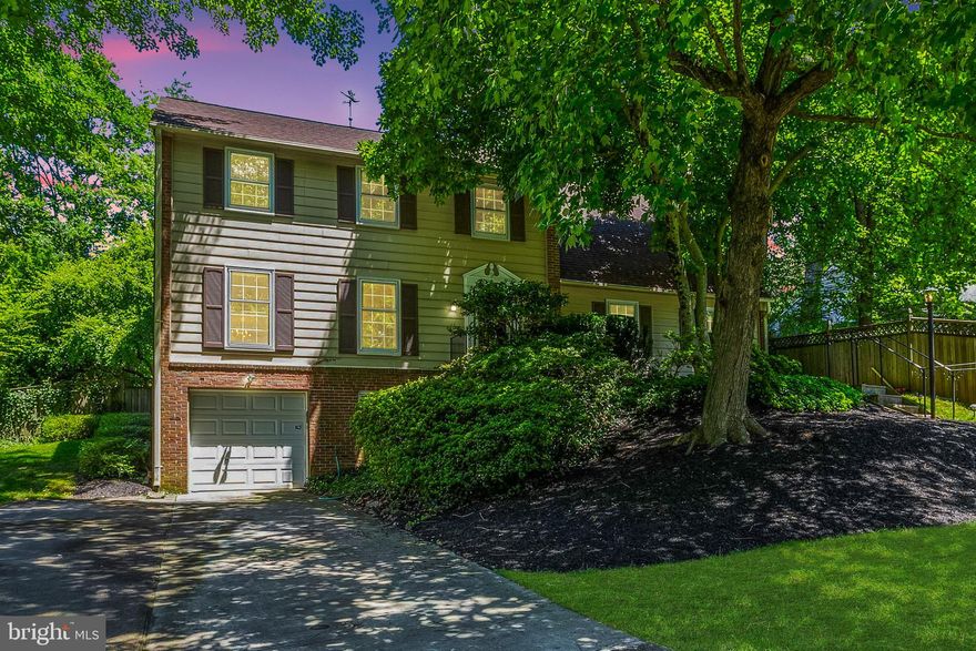 Plenty of room to grow in this 5 Bedroom 2.5 Bath corner unit home with pool! Walking up the sidewalk you are greeted with a beautiful landscaped front yard and new railing. Walk into a spacious foyer with wood floors flowing throughout. Entertain in the front living room with oversized windows and two built in book shelves. Easily host family gatherings in the dining room with chair railing and center chandelier. The large eat in kitchen provides plenty of counter space, cabinet space, panty and exposed beams. A window above the sink looks out into the fenced in back yard. The family room off of the kitchen includes plush carpeting and brick wall with cozy fireplace. A sliding glass door takes you to the back yard with pool. Work from home with ease in the wood paneled office. Retreat to the primary bedroom with exposed brick wall and en-suite with stall shower.  A bonus room off of the primary bedroom is perfect for additional sitting area or bedroom. 3 additional bedrooms with wood floors and a hall bath. Summer time entertaining has never been easier with large pool, outdoor spa with cover and wood deck in the fenced in back yard. Park with ease in the basement garage with driveway. Recent updates include Siding on the sides of the property '22 Hot Water Heater '18, Roof '16, Roof in great condition with accompanying leaf guards, and French drain infrastructure. Situated close to Tilden Woods Park with community pool, lighted tennis courts, ball fields, basketball courts, tot-lot, dog park and the community recreation center and and Cabin John Park.  Convenient to shopping including Pike & Rose, Cabin John Shopping Center, Wildwood Shopping Center, and Rockville Pike. Easy access to I-270, I-495, White Flint & Grosvenor Metro. In the top rated Moco School District.