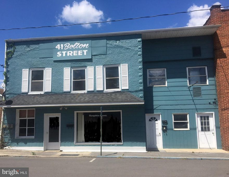 Looking for a Great Investment Property?!  Look no further!  Bring Your Imagination and Ideas!  This Property fronts Bolton Street in Romney.  There is Commercial Space on the Lower Level, Main Floor has Separate Entrances.  It is Primarily Unfinished & Open and has Lots of Potential for Multiple Use Areas.  There are 2 Apartments on the Upper Level, Both have 2+ Bedrooms, Separate Entrances and are Currently Producing $1600.00 Monthly Income.  Bring All of Your Finishing Touches and Bring this Property to Life!