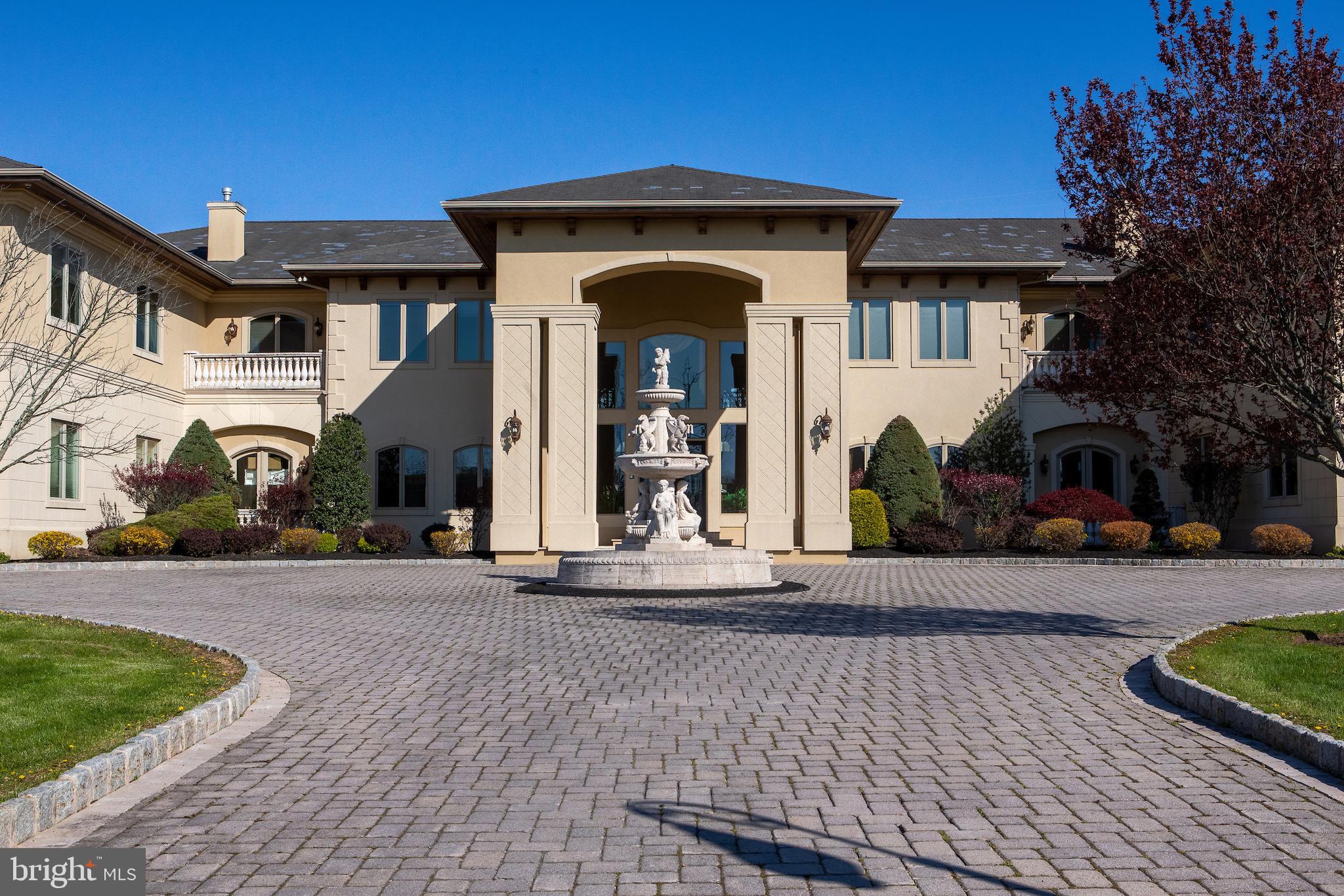 This is a once in a lifetime opportunity to own one of the best homes in Blue Bell - 1907 Skippack Pike. As you pull off of Skippack Pike, you will be welcomed by the beautiful automated gated system that opens to the .2 mile long driveway. The meticulous driveway leads back to one of the most spectacular homes in the area. This property boasts 7+ Acres, Heated 10 Car Garage, Elevator, 30,000+ sqft situated right next to Blue Bell Country Club. It would be impossible to rebuild a home of this quality and character for this price in todays market. The 30,000+ sqft is spanned over 3 floors of living space, each with its own astonishing aspects. Let's start with the basement: Chicago Bulls Hardwood Basketball Court enclosed in glass with seating above and below for weekend basketball tournaments, training sessions or just causal free throw competitions with the family/friends. There is a custom carpet throughout, 16 person movie theatre equipped with surround sound and plenty room for more chairs if needed, fully stocked wet bar in the center of the basement providing a great space for entertaining or cocktail hour when hosting large events, oversized sauna, full gym with Hyperbaric chamber, 1.5 baths just on the basement level, elevator access from basement to top floor, large family room / living area with multiple TVs. Be sure to check out the staircases flowing down from the middle floor into the basement. Also in the basement is the mechanical room for storage, hot water heaters, HVAC systems and much more. Moving onto the 1st floor: As you enter past the beautiful fountain and front landscaping, you will be engrossed by the entrance. The soaring ceilings with split staircases running up towards the sparkling chandelier provide a unique astonishing entrance into this home. You can immediately feel the immense natural light throughout the whole home right when you step foot into the foyer. To the right is your formal dining area great for large family gatherings over the holidays. To the left is your formal living area perfect for relaxing. As you walk through the foyer it will lead you into the family room. The family room has massive windows allowing you to see right into the backyard/pool area. To the right wing of the home there is the chefs kitchen. This kitchen is one of a kind. There are two massive granite islands, multiple sinks, oversized Viking Ranges, 4 ovens, oversized fridge and a mudroom off the side making it easy to bring in packages and groceries. The left wing of the first floor has 1 office, a study, library and a game room overlooking the basketball court. As we head to the 3rd floor it should be noted that there are 30 TVs throughout that will all be staying with the home, 10 Full baths, 4 half bath, and 10 Bedrooms including an amazing in-law / friends and family suite with multiple balconies overlooking the property. All of the bedrooms have plenty of space for king beds and a majority of them have on suite bathrooms. On the left upper wing of the home there is a full suite with a secondary master bedroom, living and dining space and a full kitchen. The master bedroom is enormous with multiple TVs, his and hers closets with built in shelving. The bathroom has a Jacuzzi, his and her separate vanities and a walk thru shower that has to be seen in person. The outside consists of 7+ Acres, large green space w/ a football field & field goalposts. The back patio is a great space for summer nights. There is a grill, large in-ground pool, built in slide and hot tub (more photos coming when opened for Summer). This property is in a great location in the center of Blue Bell, which allows for easy access to Philadelphia, King of Prussia Mall, Wissahickon Trail, I-476 (PA Turnpike), 276 and 76. Top Rated Wissahickon School District. Please see virtual tour link here: https://youtu.be/96vTTFXKcXU. Property being sold fully furnished. Please also request Drone property tour & 12 minute full interior tour video.