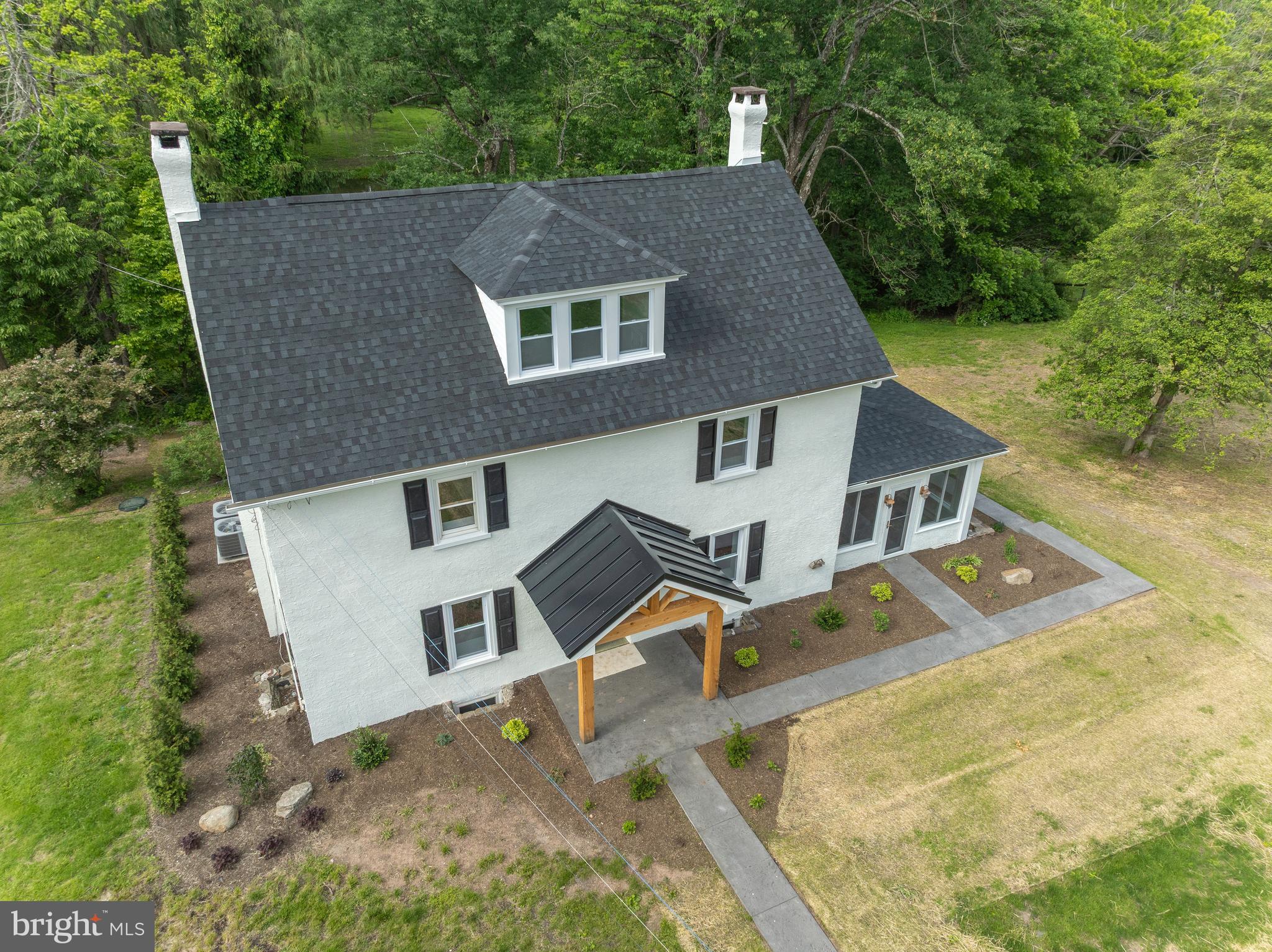 1910 Farmhouse turned into an exquisite Modern Farmhouse on over 7 acres! Completely remodeled from top to bottom. 4 bedrooms 3 custom bathrooms that must be seen to be appreciated. A brand new state of the art kitchen with stainless steel appliances and quartz countertops as well as huge quartz island. Every detail done to perfection. A bank barn that you have to see to believe with an upstairs for entertaining or numerous other functions with a poured concrete floor and lighting with sliding doors overlooking the paddock and pasture. Detached garage/workshop completely redone. Fenced in pasture with stream running through the woods. Pond with a dock. Brand new heat pumps with central air and oil heat radiators for back up. Great estate set up for entertaining with a sunroom that leads out to a wrap around flagstone patio overlooking your pond, stream and pasture. New landscaping around property as well as barn area. Watch all the wildlife come through as deer and geese surround the property on a daily basis. Immediate Possession Too!
