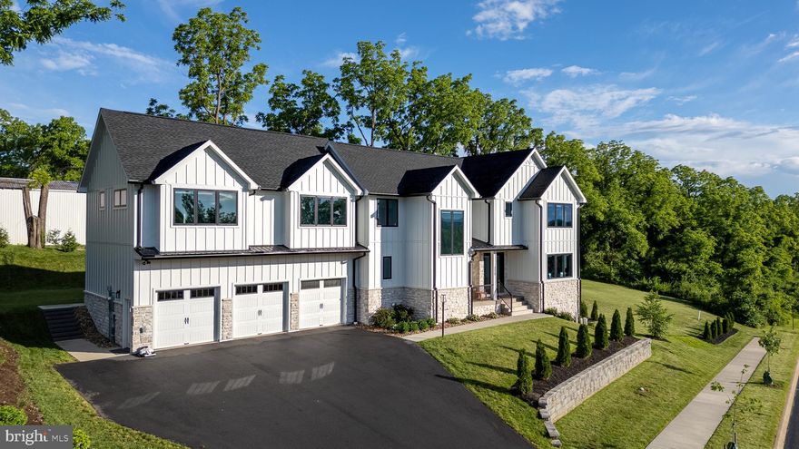 As you enter this exquisite custom-designed Singular Construction home, you'll be immediately captivated by the open floor plan, soaring ceilings, and stunning vistas. The gourmet kitchen boasts a spacious quartz waterfall counter center island with a sink and two drawer dishwashers, all complemented by matching GE Café brand appliances: a six-burner gas range and grill, double wall oven, and refrigerator. Crafted by Glicks, the open eat-in kitchen also features a full butler's pantry with a microwave, sink, small refrigerator, and quartz counters.

Throughout the home, you'll find an array of special features, including custom remotely controlled blinds, a comprehensive audio system with controls, CAT8 ethernet cable, quartz countertops, a central vacuum system, programmable features, four HVAC zones, radiant floor heat in all bathrooms, and a laundry room with cabinets, counters, and a utility closet with a sink. The home also boasts a reverse osmosis water treatment system, interior and exterior wi-fi boosters, windows with a blue tint for privacy, and a spacious mudroom with locker-style cabinetry and Rubio-finished hardwood floors.

Outside, the property offers an extended driveway leading to an oversized 3-bay garage with 3 electric car charging ports, storage shelves, multiple access doors, hot and cold plumbing, and ample electrical outlets. The perimeter features poured concrete with commercial-grade sealing, and all framing is spray-treated with a pest barrier. Additionally, the home showcases James Hardie stone plus wood-look siding, a gas line to the deck for BBQ, and to the yard for a firepit. The thoughtfully designed hardscape and landscape are tailored to maximize the breathtaking views while maintaining privacy.

Conveniently close by are parks, stores, entertainment venues, downtown, the Penn State campus, and an easy commute to the airport.