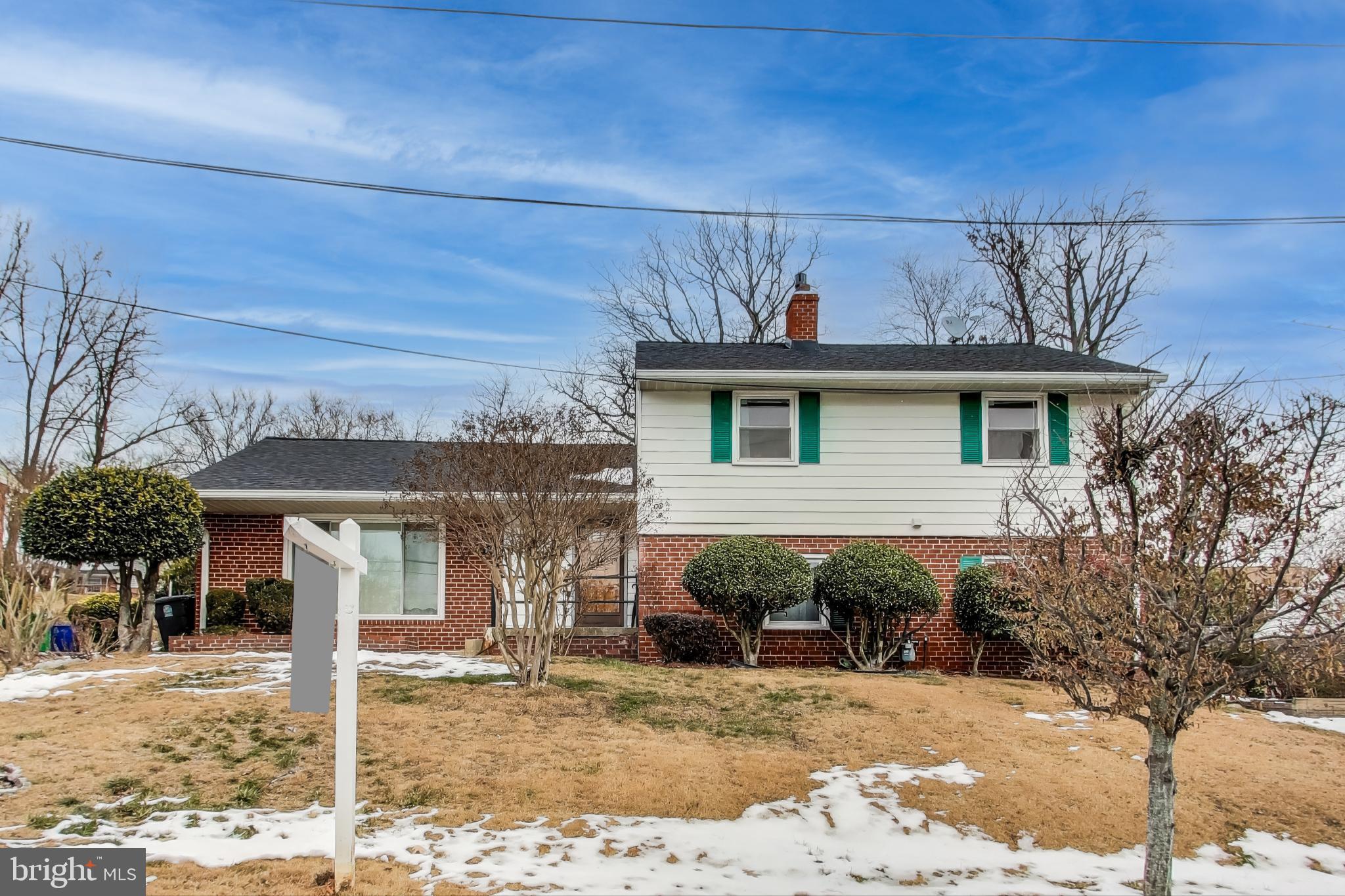 This well-maintained three-level split home offers a blend of comfort and functionality. The main level boasts an inviting eat-in kitchen, perfect for casual meals and gatherings. Upstairs, you'll find three generously sized bedrooms and two full bathrooms, including a beautifully remodeled primary bath. The lower level is an entertainer's dream, featuring a cozy wood-burning fireplace, a bar, and a convenient powder room. An additional room on this level provides the flexibility for a fourth bedroom or a home office, alongside a utility room with a side entrance for added convenience. Step outside to enjoy the spacious, screened-in porch, an ideal spot for relaxing and enjoying the view of the backyard. This home is a perfect combination of practicality and charm.