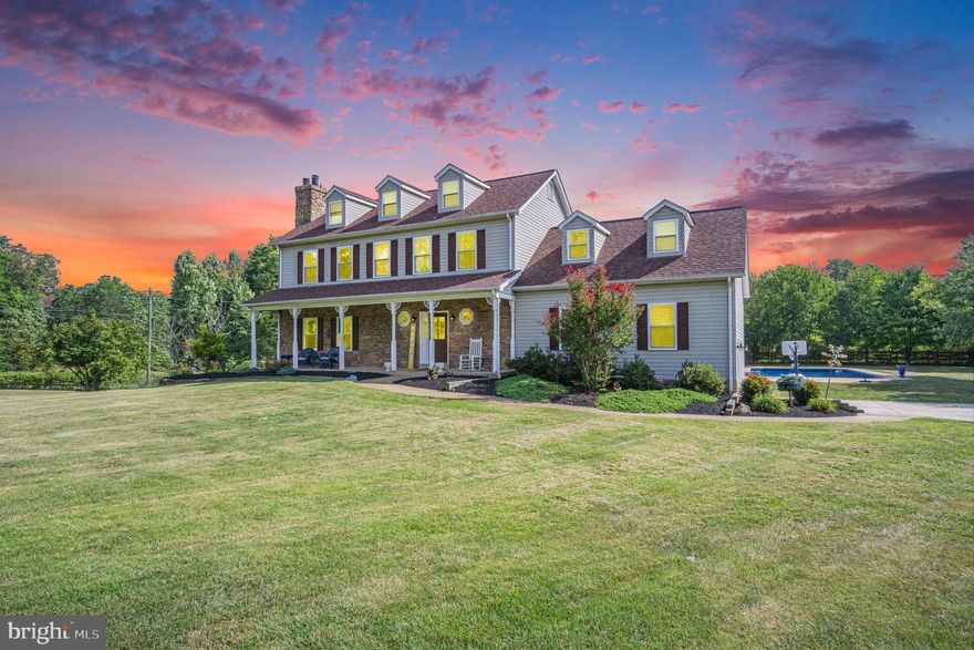 ACCEPTING BACK UP OFFERS- Welcome to this charming country-style colonial with full front porch nestled on a sprawling 2-acre lot, offering a tranquil retreat that blends spacious living with outdoor leisure. Boasting over 3,100 square feet of thoughtfully designed living space, this home presents a perfect blend of comfort and elegance. The centerpiece of the outdoor oasis is an inviting in-ground pool, accompanied by a beautifully designed patio and  deck, ideal for lounging and entertaining. A detached 2-car garage comes complete with an efficiency apartment above, adding versatility and potential for guest accommodations or rental income. The property is adorned with mature trees and well-manicured landscaping, creating a serene ambiance and ensuring privacy. A fully fenced-in yard provides security and seclusion and adorned with a stone column entrance with gate. Indoors, the finished basement with shelved storage offers ample space for various activities and recreation. The primary suite is a haven of relaxation, featuring a spacious layout with an attractive walk in closet with thoughtful storage options and an attached private office, perfectly catering to the demands of modern living. This home harmoniously combines the allure of countryside living with convenient amenities, making it a truly unique find for those seeking comfort, style, and tranquility. --Please note that the 4th bedroom and 3rd bathroom listed are the apartment above the detached garage.