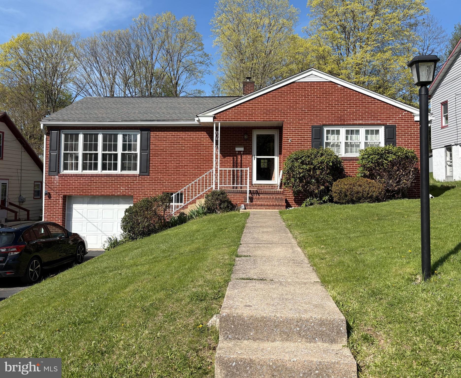 Exceptional raised ranch home. Features beautiful up dated kitchen, open floor plan dinning room and living room with new carpet and amazing natural light. Owners bedroom with 1/2 bath along with hallway full bath and 2 bedrooms. The lower level features a full bath, bedroom and large rec room. This level walks out to the front at ground level. Enter out to the pool area through the large sun room that has many possibilities. The pool was opened last season and was a great spot for summer relaxation. Lots of driveway parking and a 1 car integral garage .
