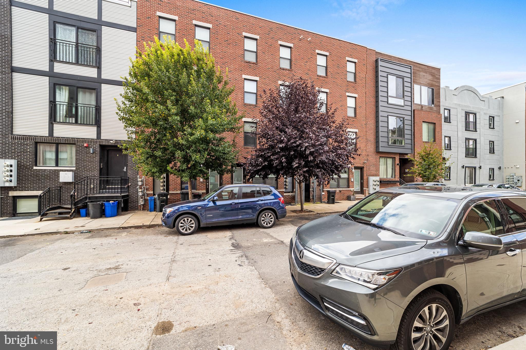 Step into the highly desirable neighborhood of Northern Liberties and claim this modern, lower-level unit as your own. Located at 970 N Marshall St, this contemporary home offers a secured entry, shared breezeway, and abundant street parking for your convenience. Upon entering, you’re greeted by an open-concept living space with engineered hardwood floors and ample natural light. The spacious living room seamlessly flows into the sleek, modern kitchen, featuring white shaker cabinets and gleaming countertops. This inviting space is perfect for entertaining guests. Off the kitchen, you’ll find a full bathroom and a versatile bedroom at the back of the home, currently set up as an office. This room boasts ample closet space and direct access to your own private patio, creating an outdoor oasis for relaxation.
Heading downstairs, you’ll discover even more updates throughout. The lower level features a large bedroom, a full bathroom, and a convenient hallway closet with a stackable LG laundry unit. The highlight of this floor is the stunning primary suite, complete with an elegant ensuite bathroom that includes a tile shower, dual vanities, and a custom closet system designed to impress.
Don’t miss the chance to make this meticulously maintained, move-in-ready home yours, with time still remaining on the tax abatement. The vibrant city of Philadelphia is calling—come make this sought-after Northern Liberties location your new home!