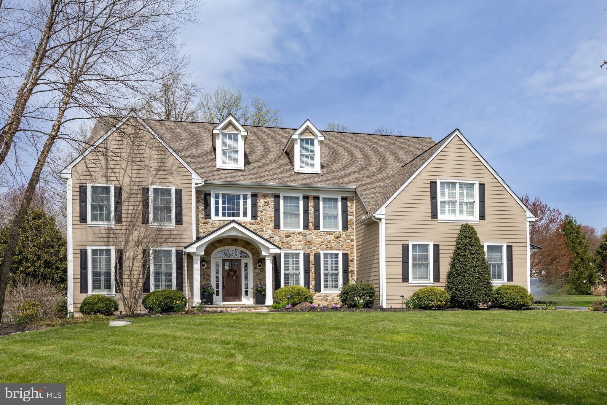 Welcome to the perfect blend of modern sophistication and timeless design at 5 Rockford Crossing Drive. With over $260,000 invested in recent renovations, this home epitomizes the essence of classic Chester County living with a contemporary twist. Nestled on nearly 2 acres in a serene cul-de-sac, enjoy unparalleled privacy and tranquility while just minutes away from Kennett Square borough, Wilmington, and West Chester borough. Step inside a grand two-story foyer that sets the tone for the elegance found throughout. To one side, a private study awaits with French doors, while the opposite side houses a formal dining room—perfect for entertaining guests. The reimagined floor plan showcases an expanded great room with a stone fireplace and a versatile bar area that can double as a playroom or library. The recently renovated kitchen boasts custom inlay cabinets, a stunning black walnut island, a porcelain slab backsplash, accented with with matching black walnut floating shelves. Top-of-the-line appliances include a Miele dishwasher, an 8-burner gas cooktop, and a 48” Sub Zero refrigerator. A breakfast area, coffee bar, and large pantry cabinet add to the functionality of this space, while the adjacent laundry room/mudroom offers seamless access to the garage and driveway. Upstairs, is an owner's suite with a sizable main room, sitting room and two walk-in closets. A newly redone modern bath with a vaulted ceiling highlighted by floor to ceiling porcelain tile, oversized mirrors and a stylish dual vanity. A soaking tub and shower complete this spa-like retreat. Two spacious bedrooms feature a shared jack and jill bath and two more bedrooms share a full hall bathroom. Entertainment opportunities abound in the finished basement, featuring a new temperature-controlled wine cellar with cork flooring, a bar area with seating, and a full bath. French doors provide access to the fenced-in backyard, highlighted by an outdoor stone fireplace on a paver patio and a deck connecting to the breakfast room. Rarely does a home with these unique renovations become available.