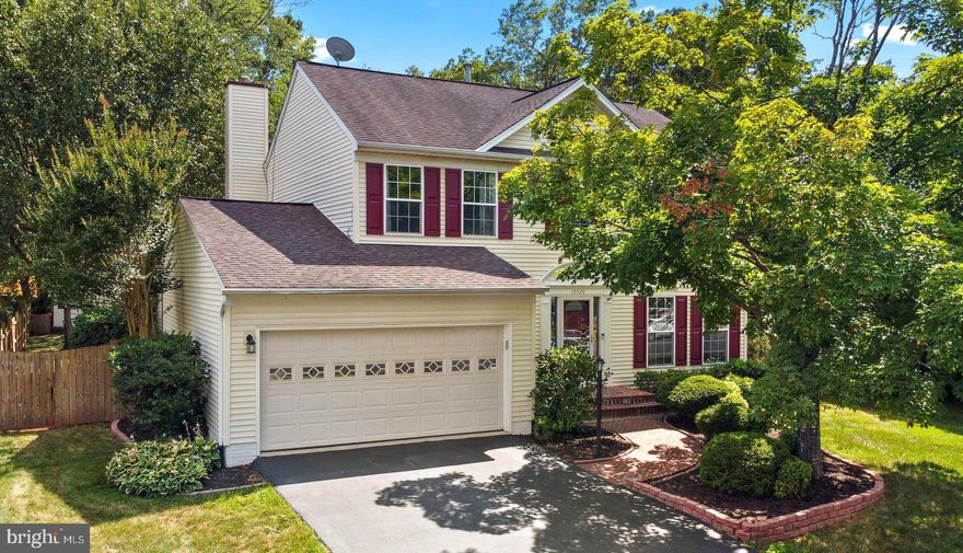 NEW PRICE! Back on the Market due to no fault of the seller- Buyer Financing fell out and home appraised! Priced to Sell ASAP!! Welcome to this stunning Colonial home perfectly situated in the coveted Great Oaks community. With 5 bedrooms, 3.5 bathrooms, 2 car garage, and a premium .28-acre lot! The main level, stairs, and upstairs hallway are adorned with elegant oak hardwood floors, while the freshly painted interior provides a neutral canvas for your personal style. The kitchen is a chef’s delight, featuring updated Maytag stainless steel appliances, durable Silestone countertops, and a cozy breakfast nook. It seamlessly flows into the family room, where a gas fireplace and large windows offer a perfect view of the backyard. Step outside to the expansive deck and patio, ideal for entertaining or quiet relaxation. The fully fenced, level backyard also includes a storage shed for convenience. Inside, the main level boasts a formal dining room, a spacious living room, a powder room, and a laundry room with direct access to the garage. Upstairs, the primary suite is a true retreat, featuring cathedral ceilings, a walk-in closet, and an ensuite bathroom with a soaking tub, double vanity, updated tiled shower, and an abundance of natural light. Three additional bedrooms upstairs offer plenty of space and comfort, each with roomy closets and stylish LVP flooring. The finished basement offers even more living space, including a large recreation room, a full bathroom, and a fifth bedroom with three closets, LVP flooring, and a large window. A walk-up entry provides easy access to the backyard. Additional highlights include a full irrigation system for the front and backyards, updated front door, rear sliding door, and insulated garage door. Enjoy all the amenities the Great Oaks community has to offer, including bike trails, tot lots, tennis and pickleball courts, and well-maintained common areas.  With quick access to Prince William Parkway, I-66, I-95, and the VRE, commuting is a breeze. Nearby attractions include the Prince William Fairgrounds, 2 Silos Brewery, The Farm Live, Super Target, and an array of restaurants. This home is move-in ready and waiting for you to make it your own.