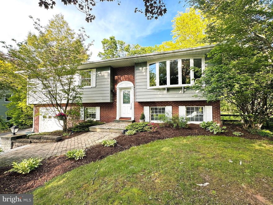 Located in one of State College's favorite neighborhoods, you'll love this sweet Greentree cutie! This lovely 4 bed/3 bath updated split entry home is nested on a quiet street and has a great 1/3 acre lot with extensive hardscaping, mature trees, gardens, and a cool two story detached garage with insulation and electric; a perfect place to create a workshop, writers loft, or art studio. The main floor of the home features a modern open floor pan with a charming dining area with wainscoting and sliding door to the back elevated covered deck providing multiple options for hosting special meals inside or out with your loved ones. The home cook will love the updated kitchen with level 5 granite countertops, beautiful toned wood cabinetry with glass accent, cute angled island, SS appliances, and bi-fold hall pantry. Spend cozy nights in the large living room with big bay window and electric fireplace, a perfect space to curl up with a good book and cup of tea. The primary suite features a serene bedroom, walk-in closet, and private bath with glass walk-in shower and dual granite topped vanity. Two additional sweet bedrooms and a nicely updated hall bath with tile surround tub/shower, granite topped vanity with large counter, and linen closet complete the main level. Downstairs you'll discover tons of updates starting with a great family room with LVP flooring, electric fireplace, and adorable under-stair book nook. Guests will love the lower level bedroom and full bath with walk-in shower, tile floors, and cute sink and you'll appreciate the additional office space and updated laundry with folding counters, tile floors, and sink! Access to the one car integral garage and a separate door up to the back yard add great usage potentials to this area! You'll appreciate having AC, radon mitigation, and a brand new hot water heater. Play space abounds in the private backyard with lovely patio, fenced garden area to grow your summer harvest, an established raspberry patch, and apple, peach, and pear trees! The convenience of this neighborhood can't be beat with nearby Corl Street Elementary, State High, Welch Pool, bike paths and Orchard Park. You'll love being near it all while still tucked away on a peaceful tree lined street. Welcome home!