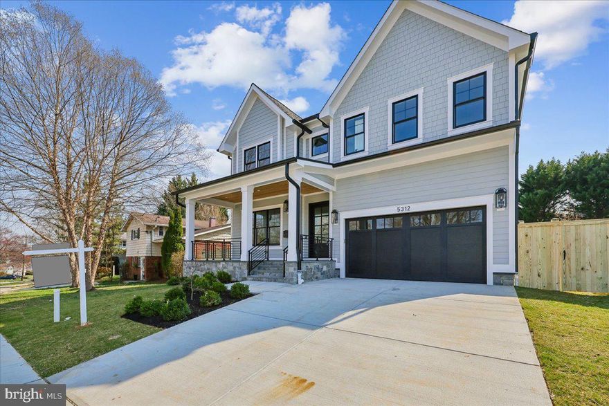 Introducing 5312 Bangor Drive, a newly constructed custom home in Garrett Park Estates where organic, contemporary design meets thoughtful craftsmanship. This five bedroom, four-and-a-half-bathroom residence is filled with striking architectural details, including White Oak flooring, 10-foot ceilings, brass accents, natural wood elements, designer fixtures, recessed lighting, and inviting outdoor spaces. A stone covered front porch with a tongue and groove wood ceiling leads into a welcoming foyer. The light filled living room with expansive windows and recessed lighting flows into the formal dining room with crown molding and an elegant chandelier.
The great room serves as the centerpiece of the home, featuring built-in cabinetry flanking a gas fireplace and access to the covered flagstone porch. The open concept layout highlights a chef’s kitchen with a Jenn Air appliance suite, a professional grade six-burner gas range with brass knobs, quartz countertops and backsplash, brass finishes, an extensive floor to ceiling wall pantry, an additional pantry, and a large center island with waterfall counters. A sun filled breakfast area sits just off the kitchen. Adjacent to the two-car garage is a mudroom and drop zone with built in cubbies and shelving. The main level is complete with a powder room.

The stairway to the second level is enhanced by a large square picture window. Upstairs are four spacious en-suite bedrooms and four well-appointed full bathrooms. The primary suite features treetop views, recessed lighting, a tray ceiling, an elegant chandelier, and a large walk-in closet with an extensive organizing system—you will love this closet. The spa inspired bathroom includes a double sink quartz vanity, a free-standing soaking tub with a floor mounted faucet, a glass enclosed shower with fluted tile, a handheld wand, and a built-in bench, along with a separate toilet closet. A versatile upper landing provides space for a desk area, and there is a well-equipped laundry room with cabinetry. Three of the end-suited bedrooms include walk-in closets, and all bedrooms feature White Oak flooring and overhead lighting.

The lower level offers durable luxury vinyl flooring, an impressive recreation room with recessed lighting, and a wet bar with a wine refrigerator, and ample cabinetry. This level also includes a gym, an additional bedroom, a full bathroom, and a utility room with generous storage.

The deep fenced backyard provides space to run and play. Enjoy the outdoor setting with a covered flagstone porch and a level, newly grassed yard ideal for relaxing or entertaining. Ideally located in the Walter Johnson school district, this home is just blocks from the Strathmore Grosvenor Metro, the MARC train, Rock Creek Park, Strathmore Music Center, White Flint Park, Garrett Park Elementary School, and the North Bethesda shops.