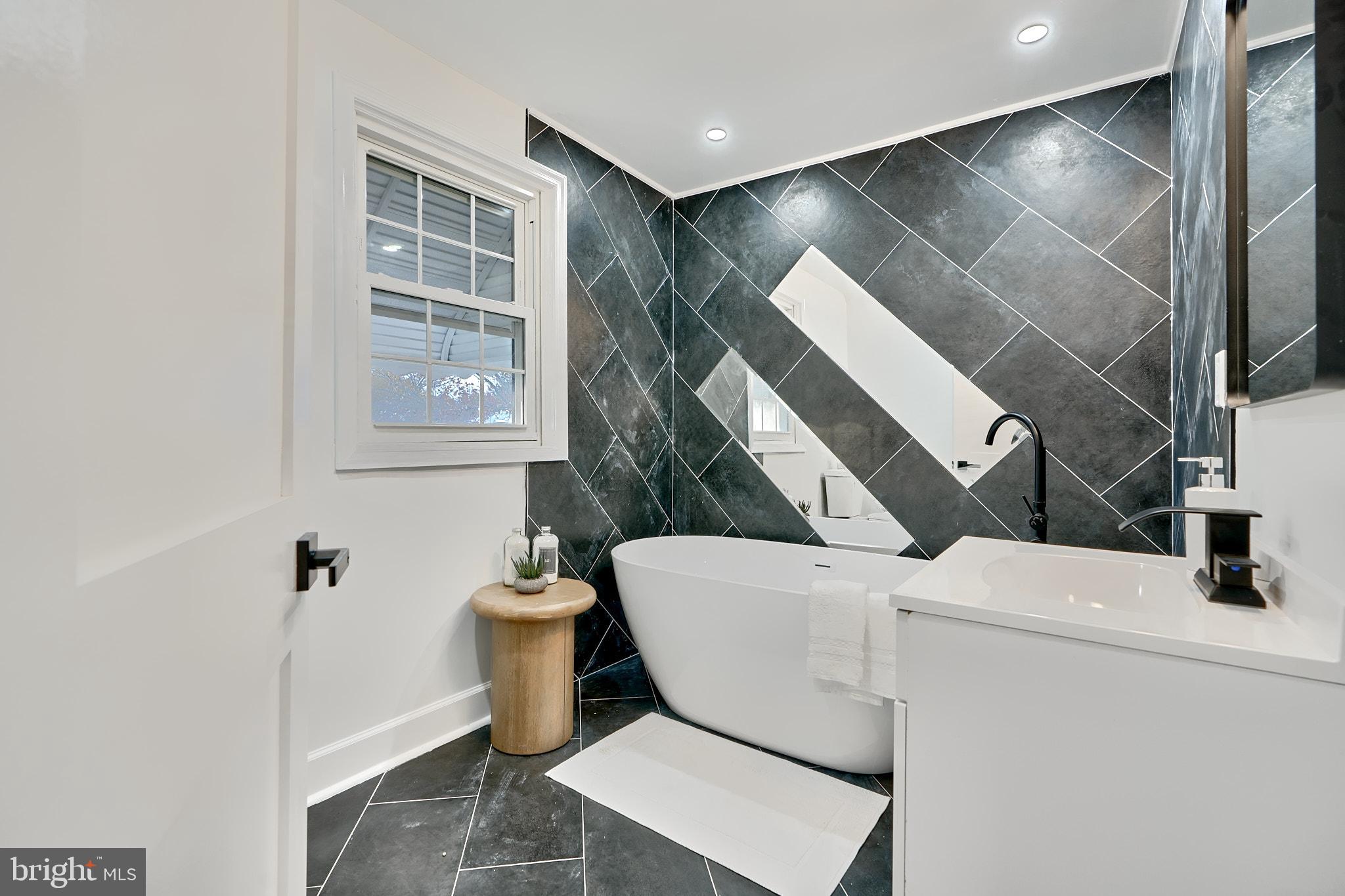 Welcome to 3707 Dennlyn Rd, a fully renovated detached single family home in the heart of historic Ashburton. Decked out with features and amenities, this home is one-of-a-kind and is sure to impress! The main level includes an open floor plan that is perfect for entertaining, recessed fireplace, large dining area and a bonus sunroom that is perfect for a home office. Check out the IG-worthy accent wall that anchors the dining area! The kitchen is a chef's dream and offers quartz countertops, a chic stone backsplash, stainless steel appliances and plenty of storage space! There's also a half bathroom and an additional sunroom, which could be utilized as a pantry, mudroom or additional living space. Upstairs offers two generously sized bedrooms, a guest bathroom with tub/shower combo and plenty of storage space. The primary suite is jaw-dropping and offers a restored original wardrobe for storage and access to the ensuite bath. Offering tile work like you've never seen before, this primary bathroom is sure to impress. Imagine ending your days in this luxurious soaking tub! The basement is fully finished and offers a second fireplace with tile surround, rec room, fourth bedroom and additional full bathroom. The home is completed by the rear fenced-in yard, garage and parking pad! With a brand new room and systems, this turnkey masterpiece that is ready to be called your home!