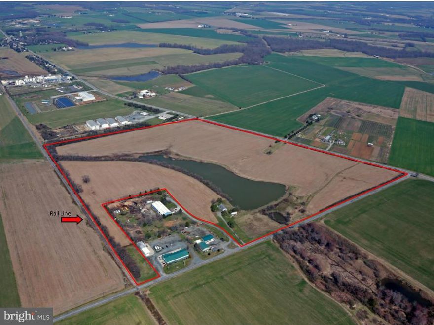 Industrial Zoning adjacent to Rail line. 62 tillable acres, leased for CY2016. 8AC Pond.