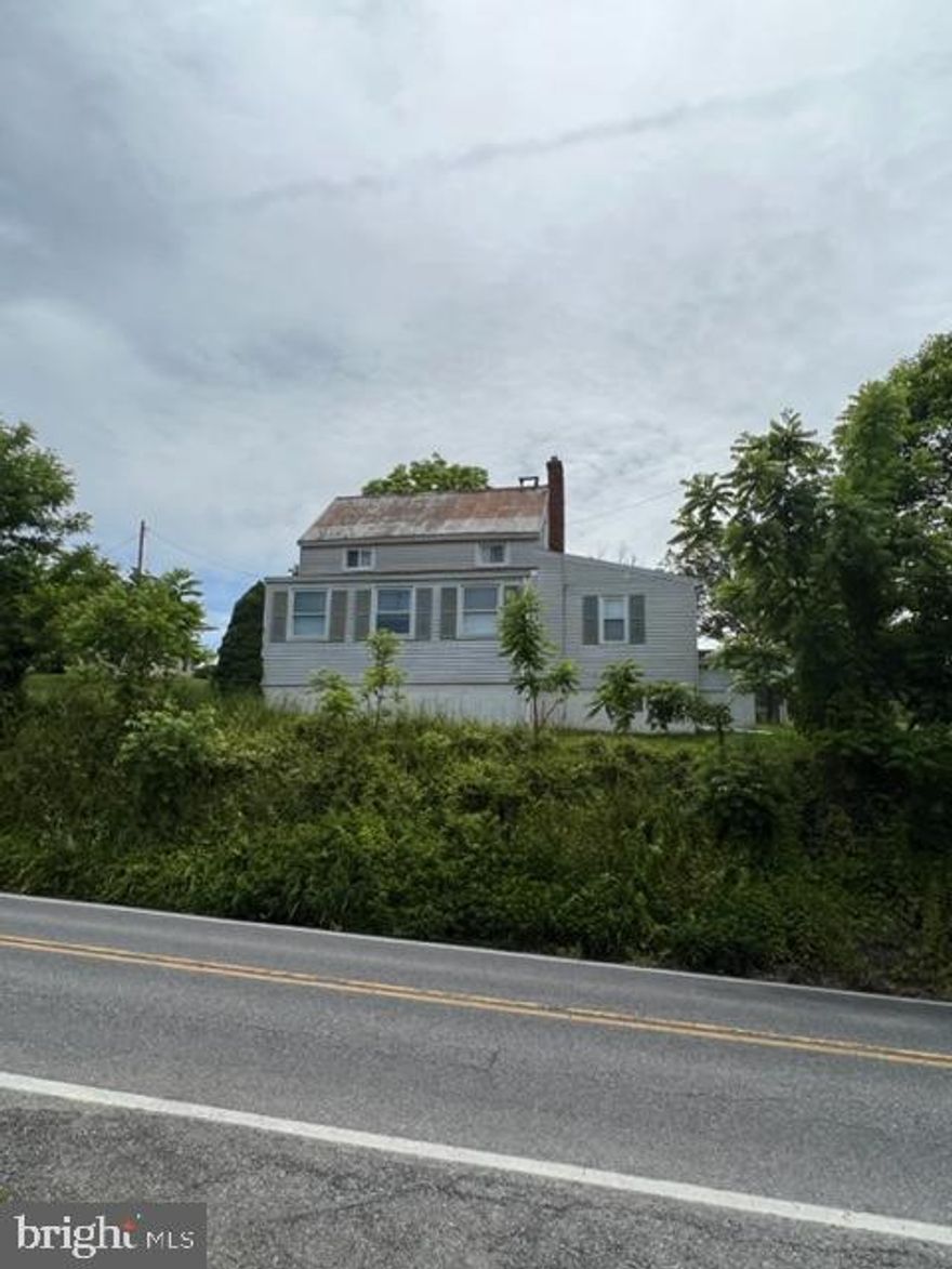 **10.43 ACRES IN FREDERICK COUNTY** Looking for the ability to have gardens, horses, goats and/or chickens. Farm house and several out buildings, some with electric as well. 3 Bd and 1Ba house, NO HOA.