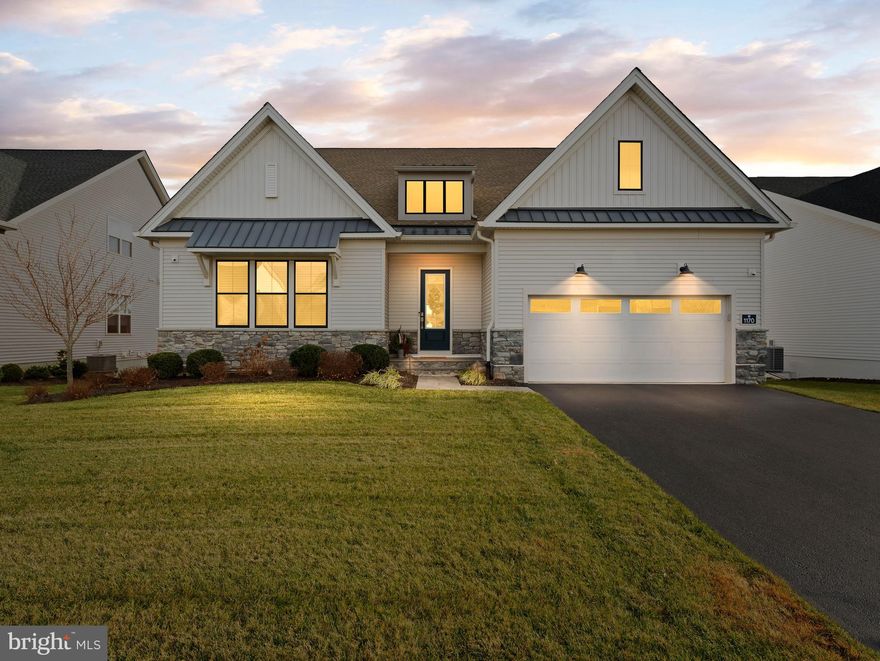 Welcome to 1170 Wythe Blvd, an elegantly upgraded luxury residence set on one of the premier lots in Regency at Waterside by Toll Brothers. From the moment you enter, rich dark flooring, custom trim work, and a sun-filled great room anchored by a perfectly positioned fireplace create a refined first impression that carries throughout the home.

The gourmet kitchen showcases an impressive center island, the builder’s highest-level cabinetry, and a seamless open layout designed for both everyday comfort and sophisticated entertaining. Just beyond, an oversized back deck invites you to relax with unobstructed views of one of several ponds and surrounding natural landscape, truly an exceptional backdrop for morning coffee, sunrises, and quiet daily enjoyment.

The first-floor primary suite offers a luxurious and private retreat, while the upper-level guest bedroom and loft provide beautifully appointed spaces ideal for hosting, working, or unwinding. A rare oversized storage area above the garage offers remarkable convenience, delivering long-term organization without sacrificing valuable interior living space.

Enhancing the home even further are its premium mechanical and structural upgrades, including a whole-house fire suppression system, a high-quality water softener, three-zone heating and cooling, lawn irrigation, an expanded primary shower, open staircases to the upper and lower levels, an expanded garage as well as the peace of mind comes with approximately seven years remaining on the structural builder warranty.

The finished walk-out basement adds even more versatility, offering dedicated space for fitness, hobbies, media, or guest overflow all with direct outdoor access.

Life at Regency at Waterside is defined by luxury and ease. Residents enjoy access to a world-class clubhouse with indoor and outdoor pools, state-of-the-art fitness studios, pickleball and bocce courts, a putting green, walking trails, a dog park, and vibrant social clubs. With lawn care and snow removal included, every day feels like resort-style living in a beautifully maintained, low-maintenance community.