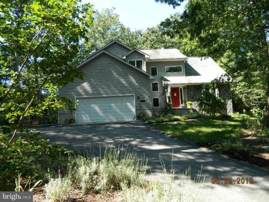 WELL KEPT HOME, SHOWS LIKE NEW, VERY NICELY LANDSCAPED, GARDNER'S PARADISE. BEAUTIFUL ALL AROUND THE HOME. LOTS OF ROSES AND FLOWERING TREES & BUSHES. VERY PRIVATE,BACKS UP TO WOODS, WITH A LARGE DECK AND A STONE SLATE PATIO. VERY LARGE ROOMS ALL THRU HOME. LARGE EAT IN KITCHEN WITH BREAKFAST BAR AND TABLE. OVERSIZED 2-CAR GARGAGE WITH LARGE TURN AROUND AREA. GREAT LOCATION, CLOSE TO EVERYTHING.