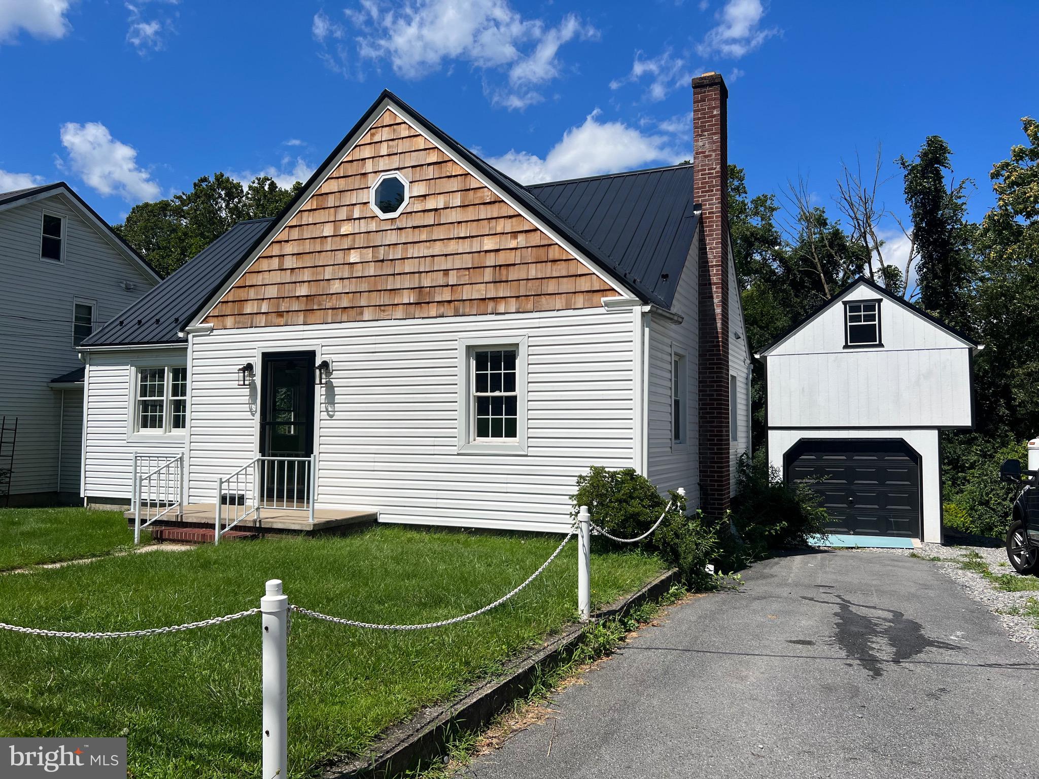Showings begin Wednesday 8/16/23. *NEW metal roof, interior and exterior insulation, siding, flooring, 200 amp electric, windows, kitchen, pantry, bathrooms, doors, bedrooms, appliances, fixtures, trim, heating/cooling, garage. *
As part of a 3 year total home renovation, this 4 bedroom 2 full bath Cape Cod is a surprisingly spacious example of quality original American construction meeting modern updates, style and sensibility. The first floor features professionally refinished antique 'heart of pine' hardwoods that roam throughout the entire main level. The house was expanded in the rear to allow for more kitchen space, a bigger dining area, along with a separate pantry (that could easily transform into a small office or stackable laundry room.) The main kitchen is a showcased custom Crownwood, and the countertop and sink area is solid stone Corian. Acacia butcher block, elegant white cabinets, and ceramic tile floors compliment the unique spin on traditional design. Off the kitchen, there is a new deck consisting of 50 yr commercial grade Trex material.
The full bathroom on the main level features ceramic tile flooring, a professionally renovated and original cast iron bathtub, subway tile surround, and all new fixtures lights and hardware. 2 ample sized bedrooms, each with their own closet, round out the main level rooms.
Upstairs, you'll find a cozy landing and 2 more bedrooms outfitted in real shiplap, complete with built-ins and hidden storage. Heating/cooling on this level is controlled by brand new Fujitsu mini split system, capable of keeping both upstairs (and downstairs) a comfortable temperature. Also added was a full bathroom focused on maximizing both space and relaxation, featuring a generous vanity, toilet, and slipper style deep soaker bathtub.
On the lower level, the basement is spacious and clean, and allows easy access to all the utilities and tip top efficient New Yorker OHW furnace. It has a workshop, laundry area with slop sink, shuffleboard court, dartboard, deep freezer, and leads to an additional storage room that opens to the backyard.
The side driveway is paved and allows for 2 parking spots beyond the 1 car garage. Above the garage, there is a loft with 9 ft ceilings waiting for the new owner to transform it into whatever they desire.
Just a short walk to the elementary, middle and high school, as well as all other landmarks and conveniences located in the heart of Mifflintown. Public water/sewer.
*Per disclosure, the Listing agent owns and has a financial interest in this property.