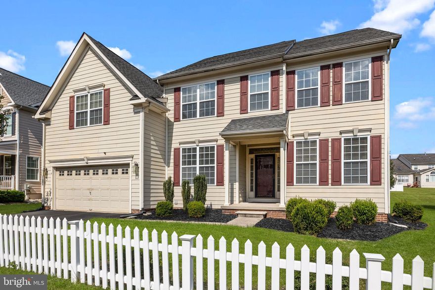 Just a short walk to Newtown Boro from this stunning 5-bedroom, over 4000 sq ft of living space, and beautifully maintained throughout! Featuring classic curb appeal with a charming white picket fence, this home offers an exceptional open floor plan and hardwood flooring across most of the main level.
Step inside through the light-filled entry with sidelights and transom window, and you’re welcomed by a gracious foyer and formal dining room accented with shadowbox trim and crown molding. The dramatic two-story family room is the centerpiece of the home, showcasing a gas fireplace with oak mantel and an abundance of natural light from oversized windows.
The bright and inviting kitchen features  42” cabinetry - ample prep counter space, stainless steel appliances, recessed lighting, and a center island with seating—perfect for everyday living and entertaining. The adjoining breakfast area overlooks the backyard and stamped concrete patio, creating a seamless indoor-outdoor flow. A first-floor study provides the ideal space for working from home.
Upstairs, you’ll find 5 generously sized bedrooms, including a spacious primary suite with tray ceiling, custom molding, walk-in closet, and a well-appointed en-suite bath with double vanity, corner soaking tub, and separate shower. All bedrooms offer ample closet space and tasteful finishes.
Additional highlights include a finished basement offering flexible living space work out area.  2 car garage.  The move in ready home is perfectly  located just minutes from the charm of Newtown Borough, with easy access to Route 1 and I-95 for convenient commuting to Princeton, Philadelphia, and New York City—this home truly combines location, space, and style.