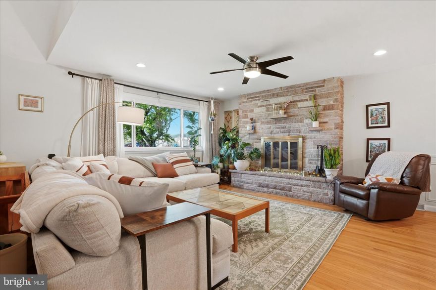 Live with ease in this idyllic split-level home on serene Hilldale Road, where a flat, fenced-in yard and thoughtfully designed interior offer both comfort and room to grow. From the moment you step inside, the open floor plan makes an impression, highlighted by exposed stone and a striking fireplace that anchors the main living space. The sun-filled main level is designed for gathering, with a spacious dining area and generous kitchen counter seating that makes hosting effortless. French doors open to a covered patio and backyard, creating seamless indoor-outdoor flow for entertaining, relaxing, or everyday living. The kitchen blends warmth and function with stainless steel appliances, butcher block countertops, and an oversized peninsula ideal for casual meals, prep space, or working from home. Upstairs, three well-proportioned bedrooms provide peaceful retreats. The bright primary suite features a walk-in closet and an en suite bath with shower. A hall bathroom with timeless vintage tile and vanity adds character and charm. The expansive lower level, complete with new wood flooring, offers exceptional flexibility. With a large walk-in cedar closet, dedicated laundry room, and ample space for a den, office, guest area, or additional bedroom, the possibilities are endless. Ideally located within walking distance to parks and the elementary school, and surrounded by tree-lined streets and manicured lawns, this home offers a rare combination of tranquility, convenience, and everyday livability.